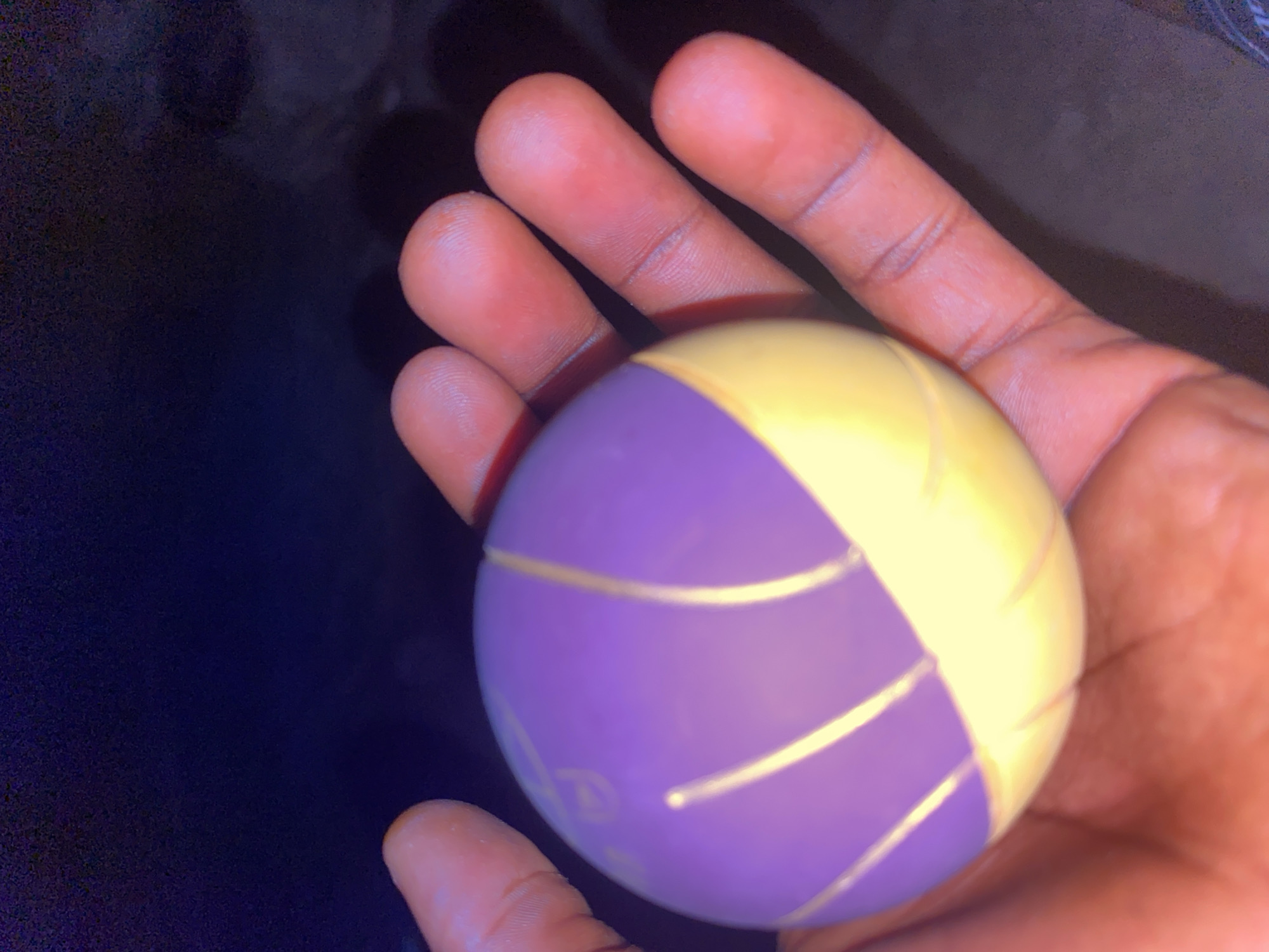 Close-up looks at a small ball on a Nigerian night road