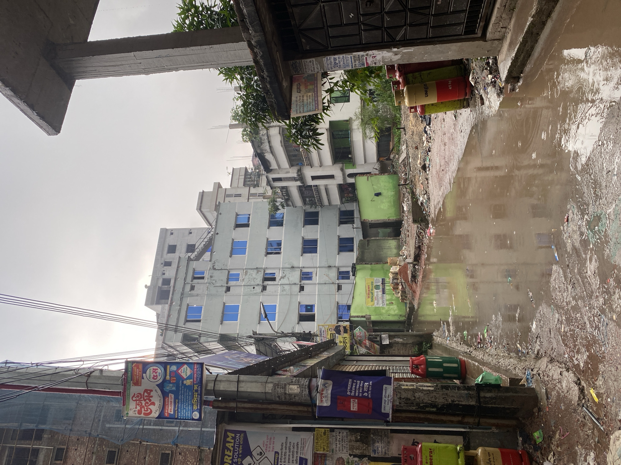 Morning rainfall floods Dhaka streets, affects construction sites