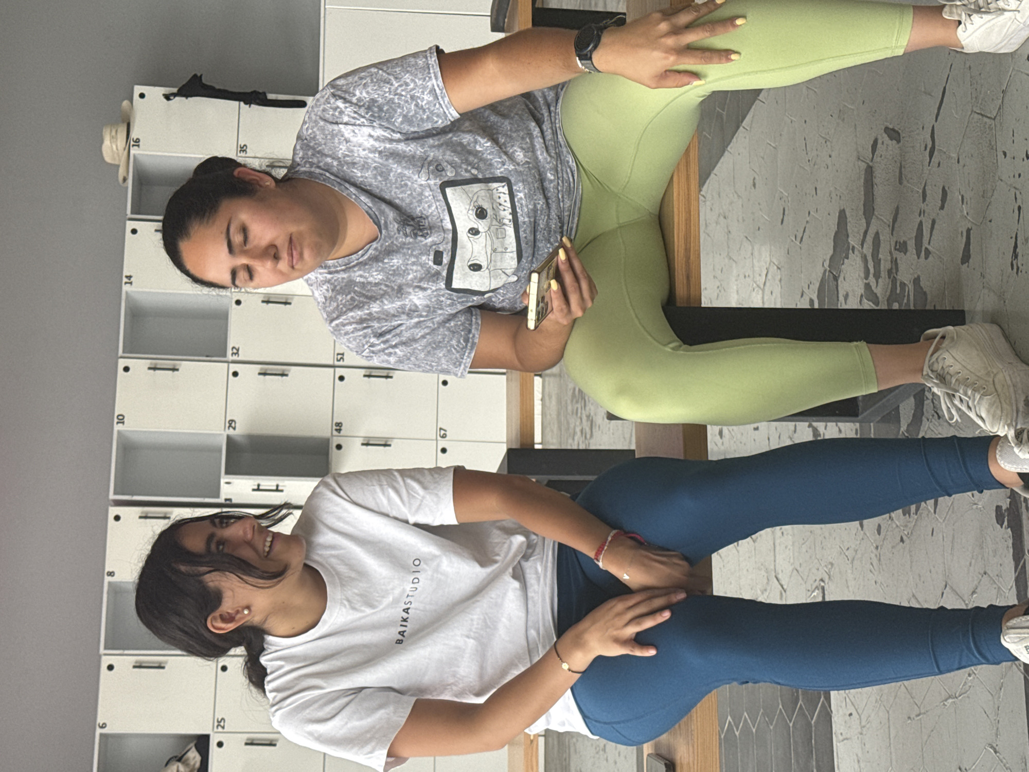 Two women game and socialize at Puebla facility