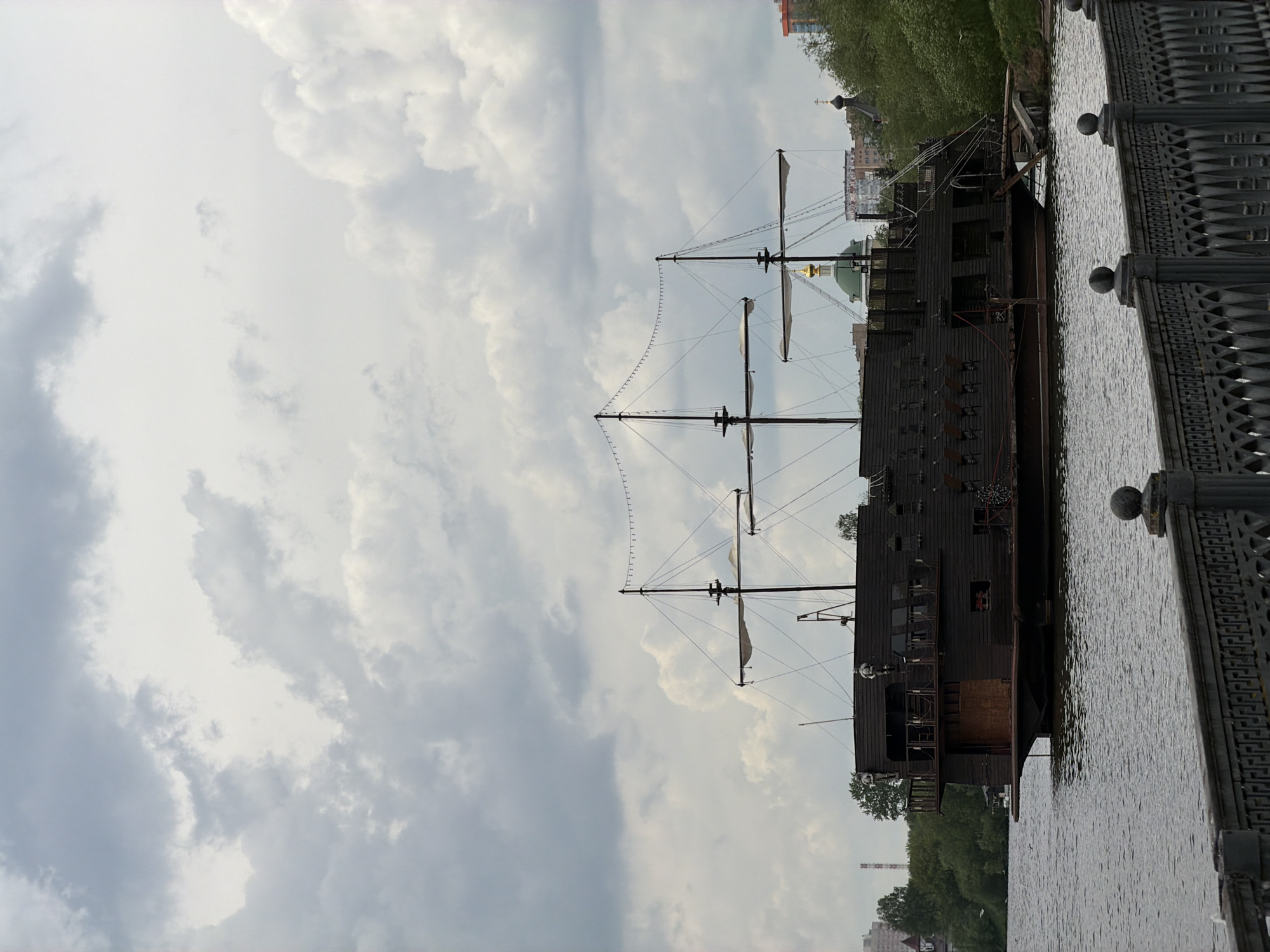 Waterfront walkway with pink running track, replica ship documented Krasnogorsk