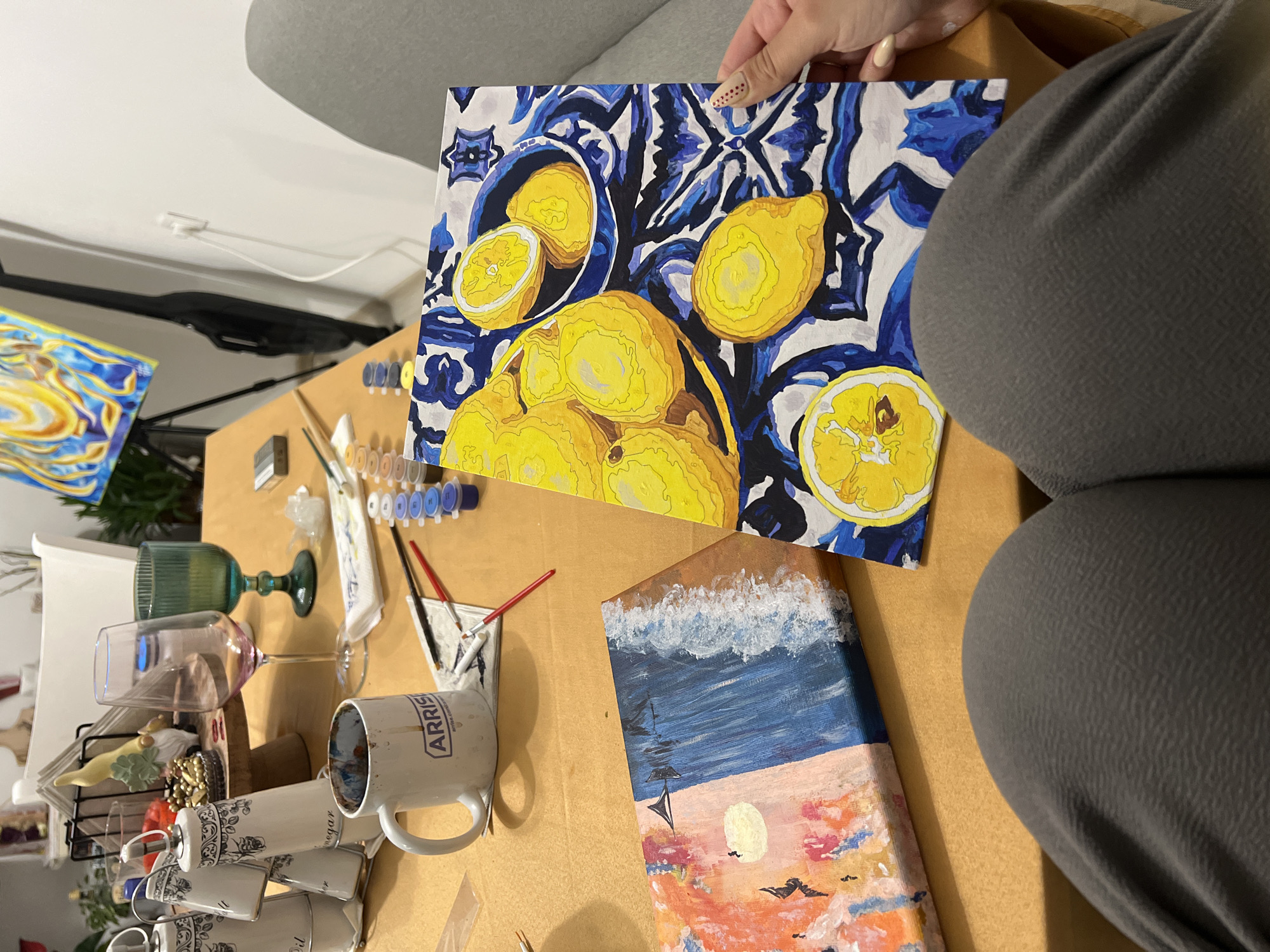 Artist displays lemon painting indoors in Smolyan, Bulgaria