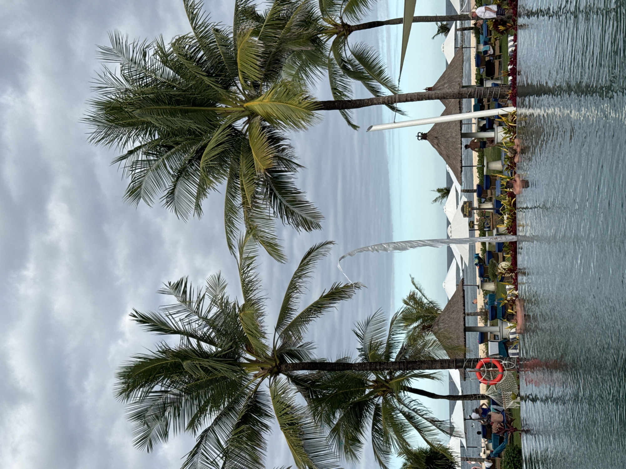 Tourist documents morning stroll through Kuta Selatan beach resort