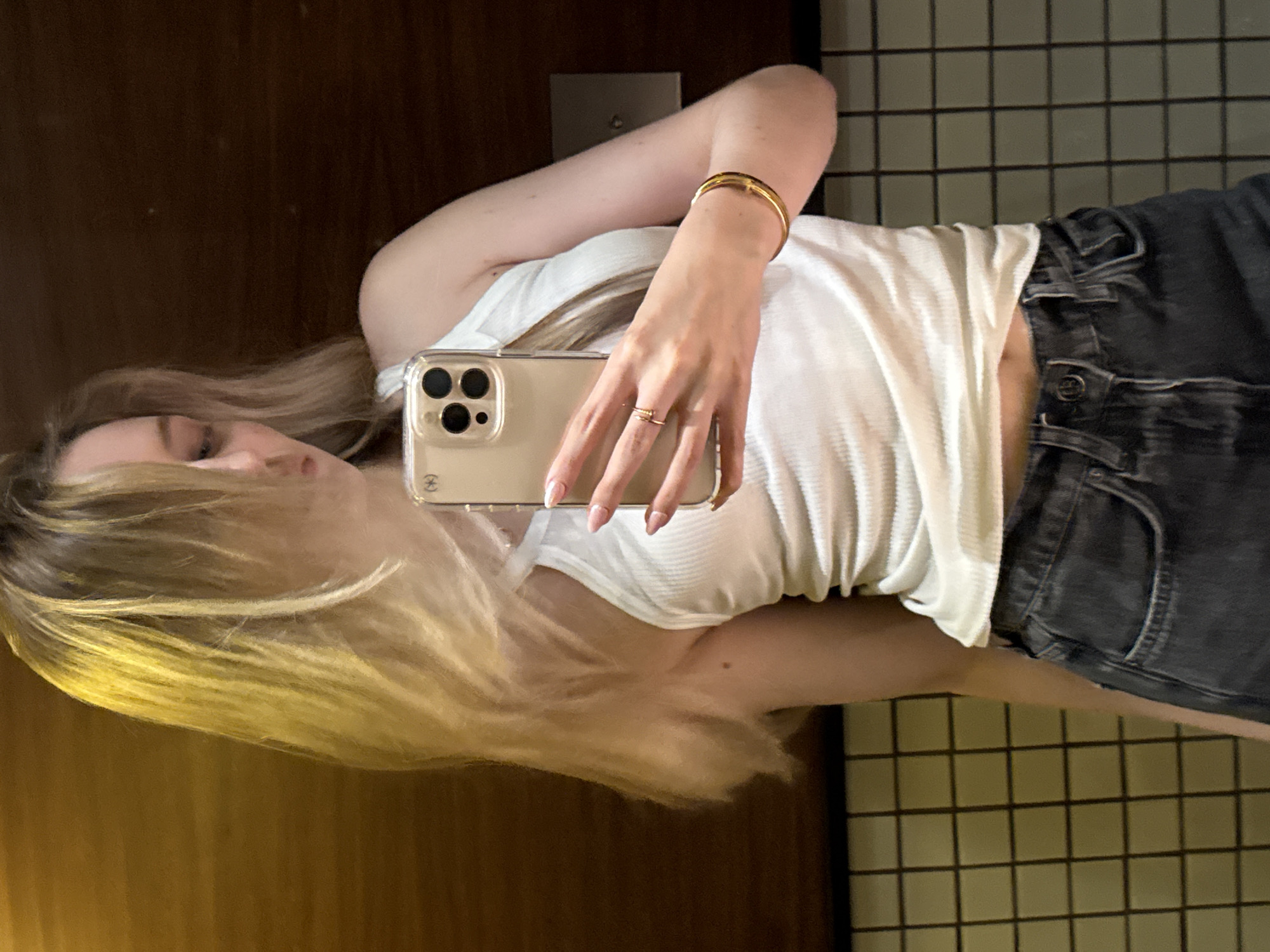 Woman takes mirror selfies in Mexico City bathroom