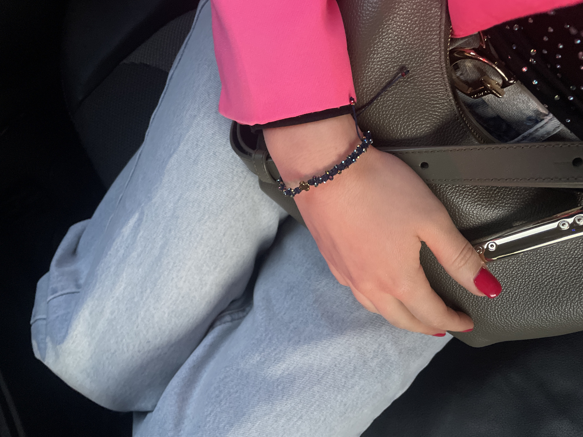 Woman in pink blazer observed at indoor venue in Varna