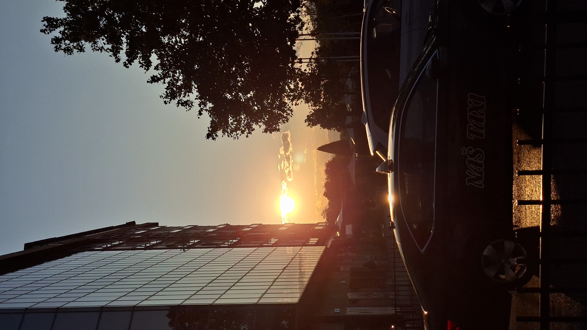 Golden-hour streets in Podgorica, with a Teatro Budva poster nearby