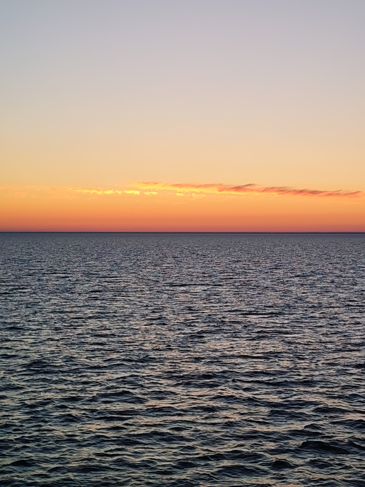Dawn waters photographed under orange-purple sky in Russia