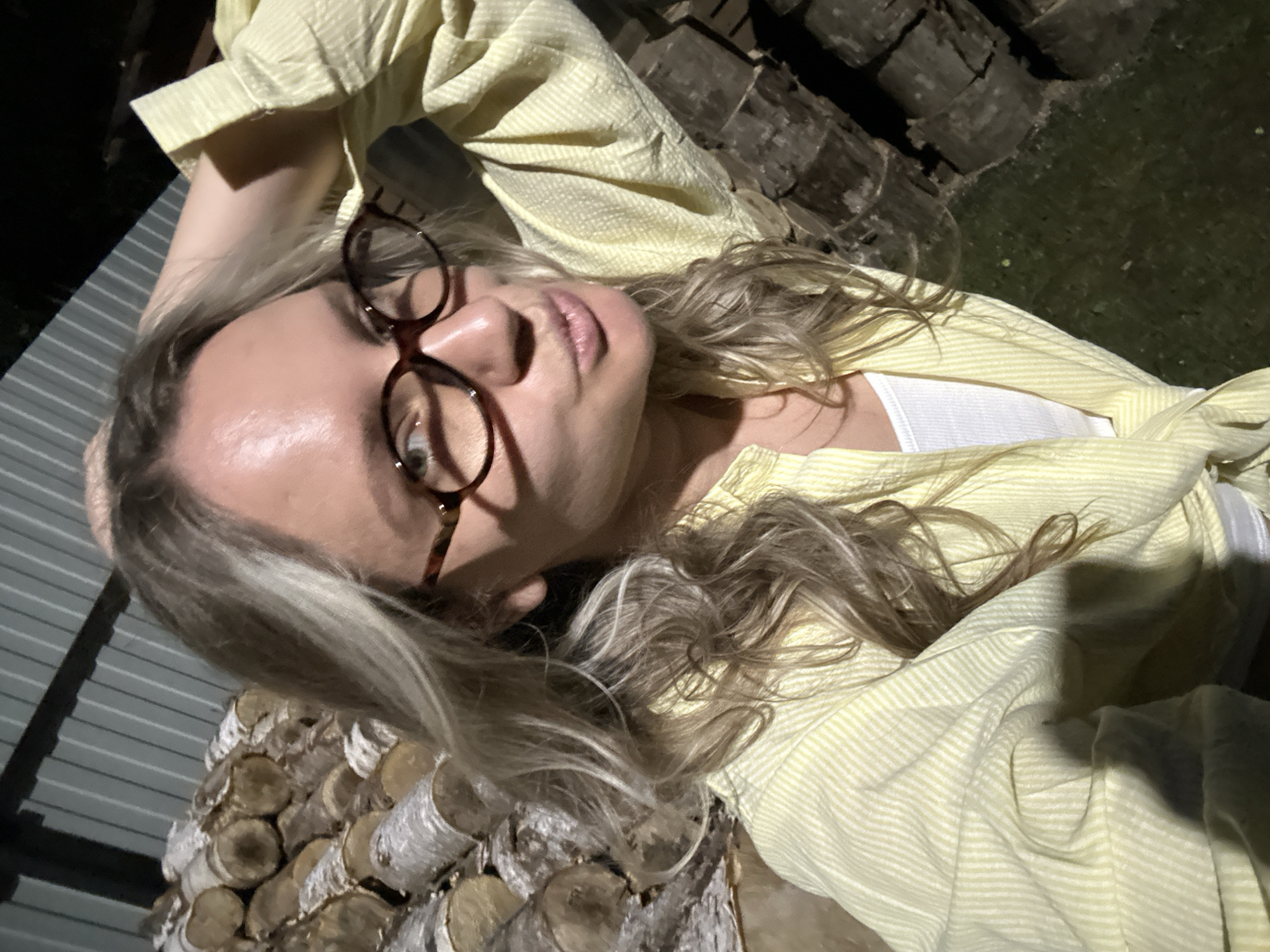 Nighttime selfie in Slantsy, tortoiseshell glasses and striped shirt