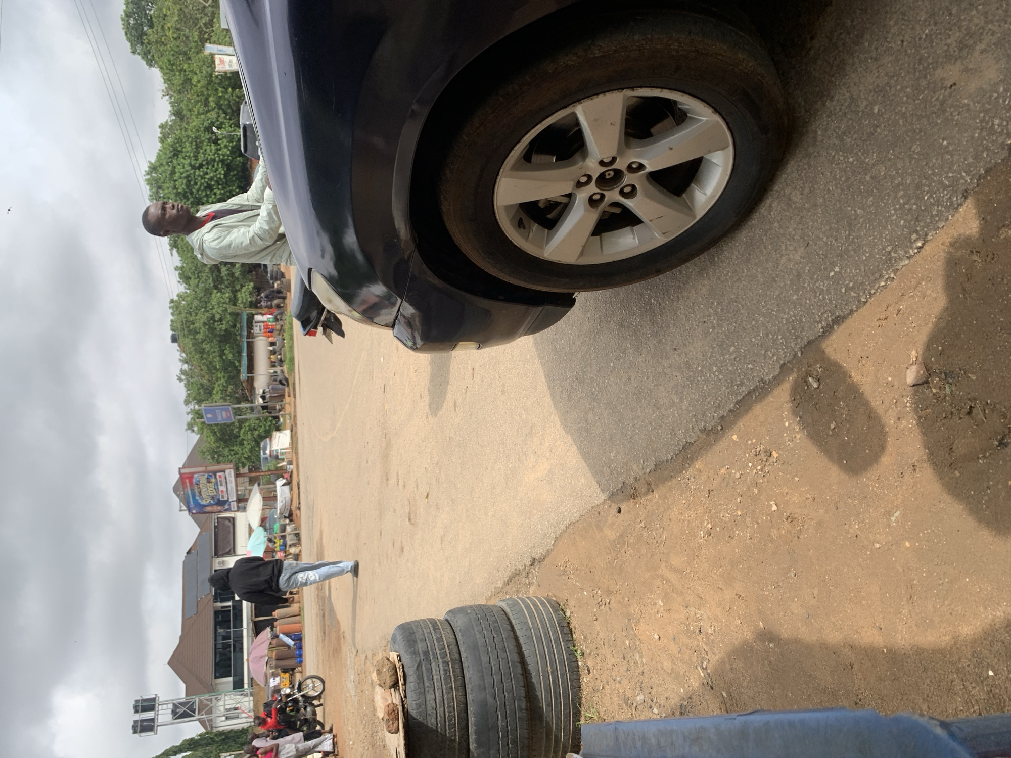 Morning street life unfolds across Abuja on overcast Saturday
