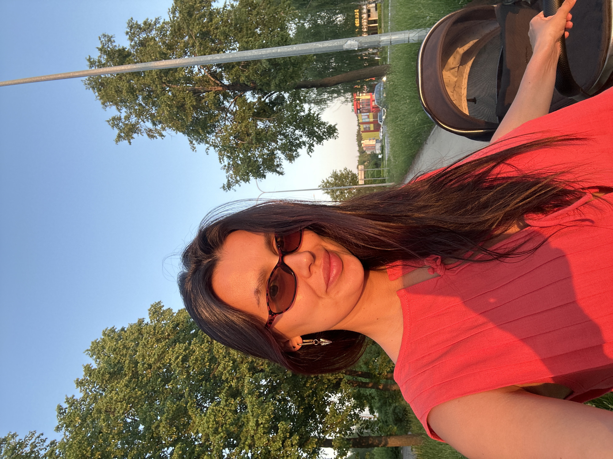 Woman takes selfies while strolling with baby in Chaikovsky