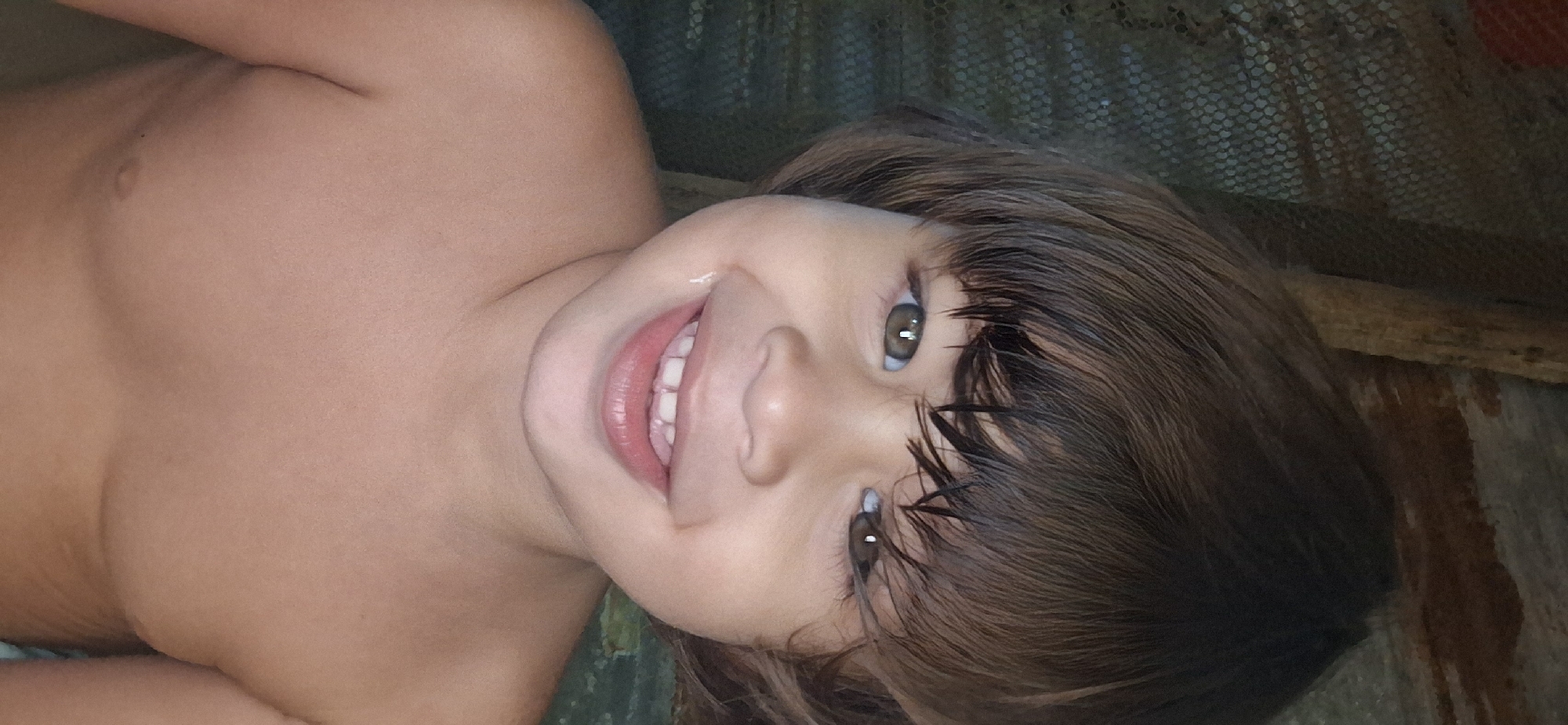 Child photographed smiling in portraits in Vallecito, Venezuela