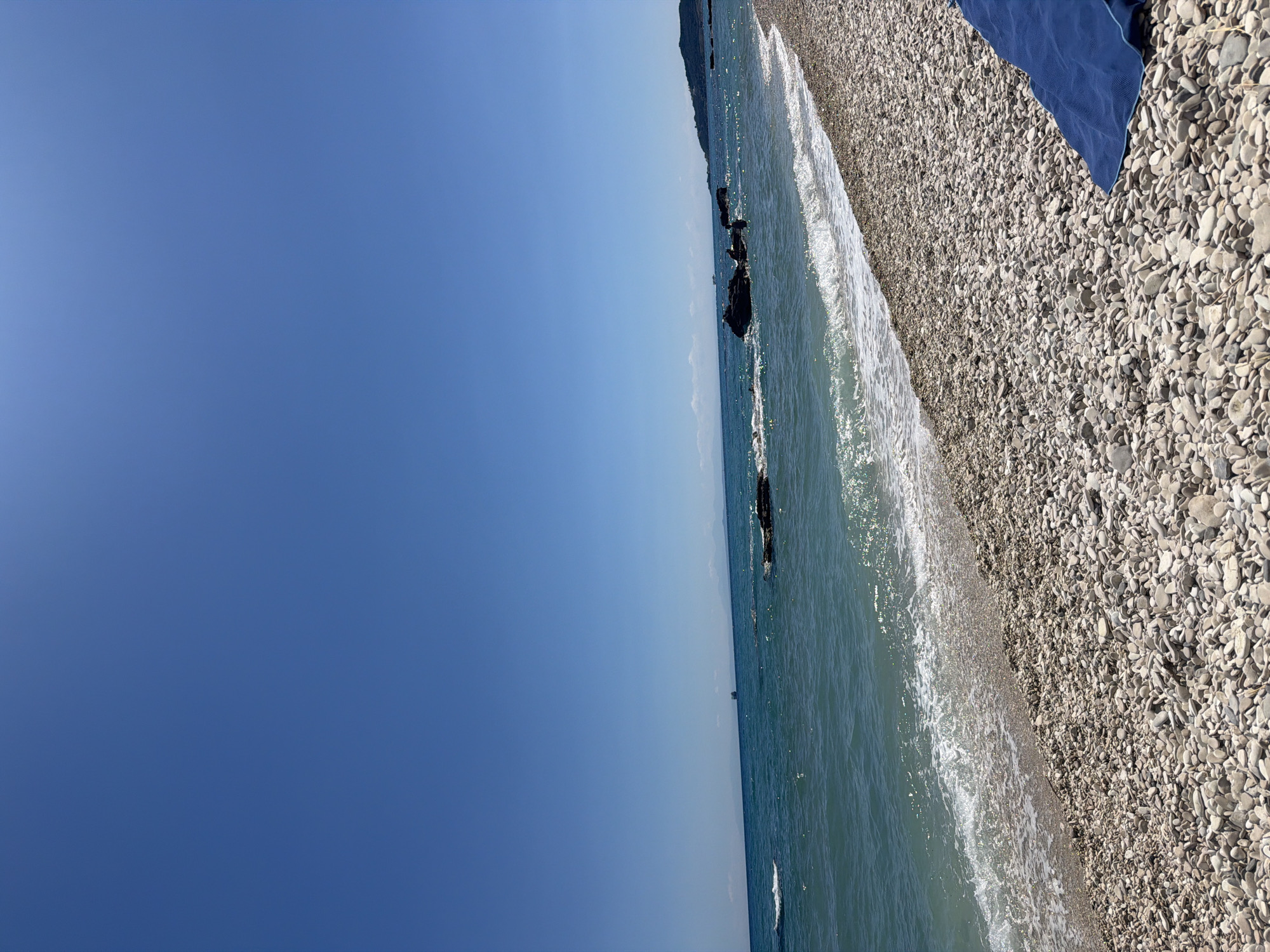 Lazy morning at a pebble beach in Elaties, Greece