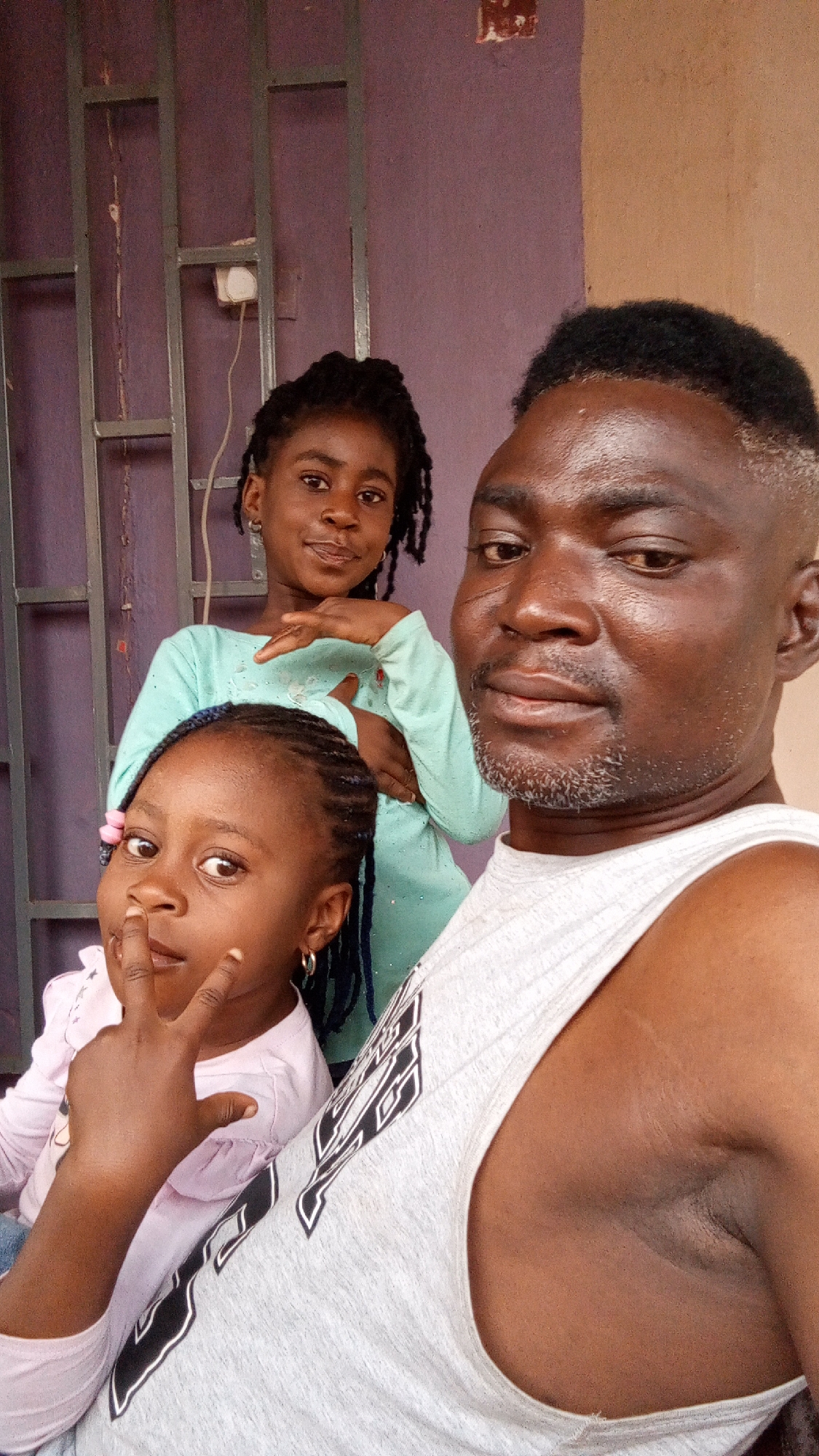 Family captures casual moments in Nigerian neighborhoods