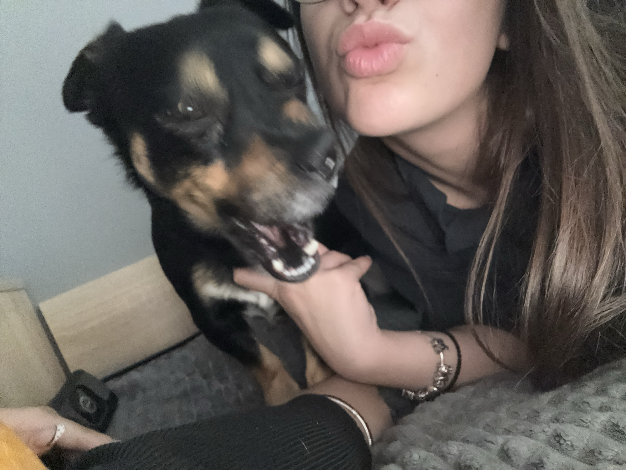 Woman shares affectionate moment with dog in Bulgarian home