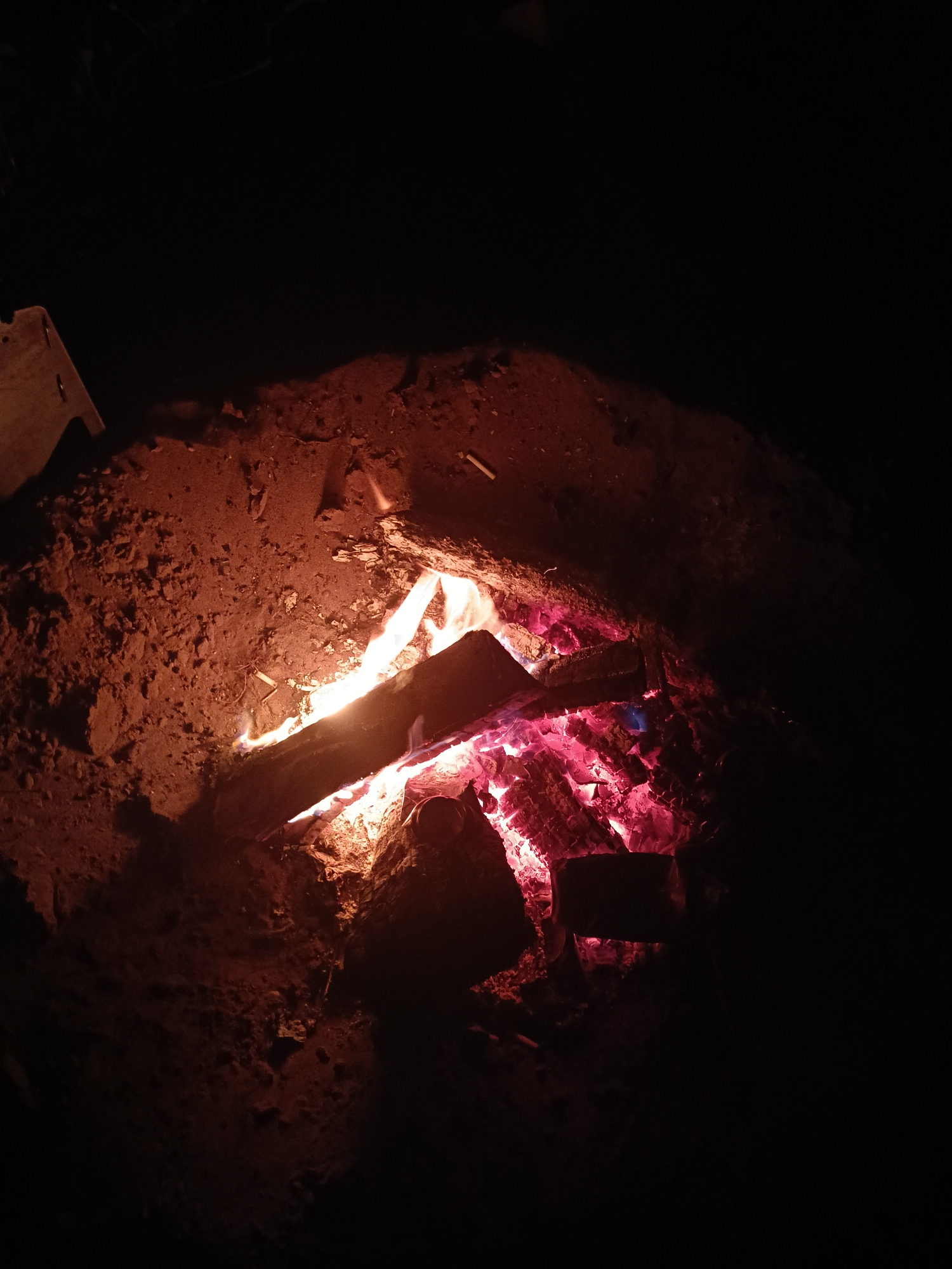 Evening campfire gathering by Vakh River in Noviy, Russia