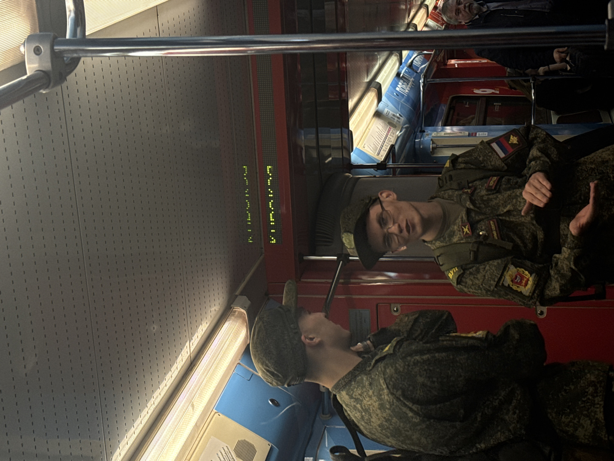 Russian soldiers ride Moscow Metro train through northwestern districts