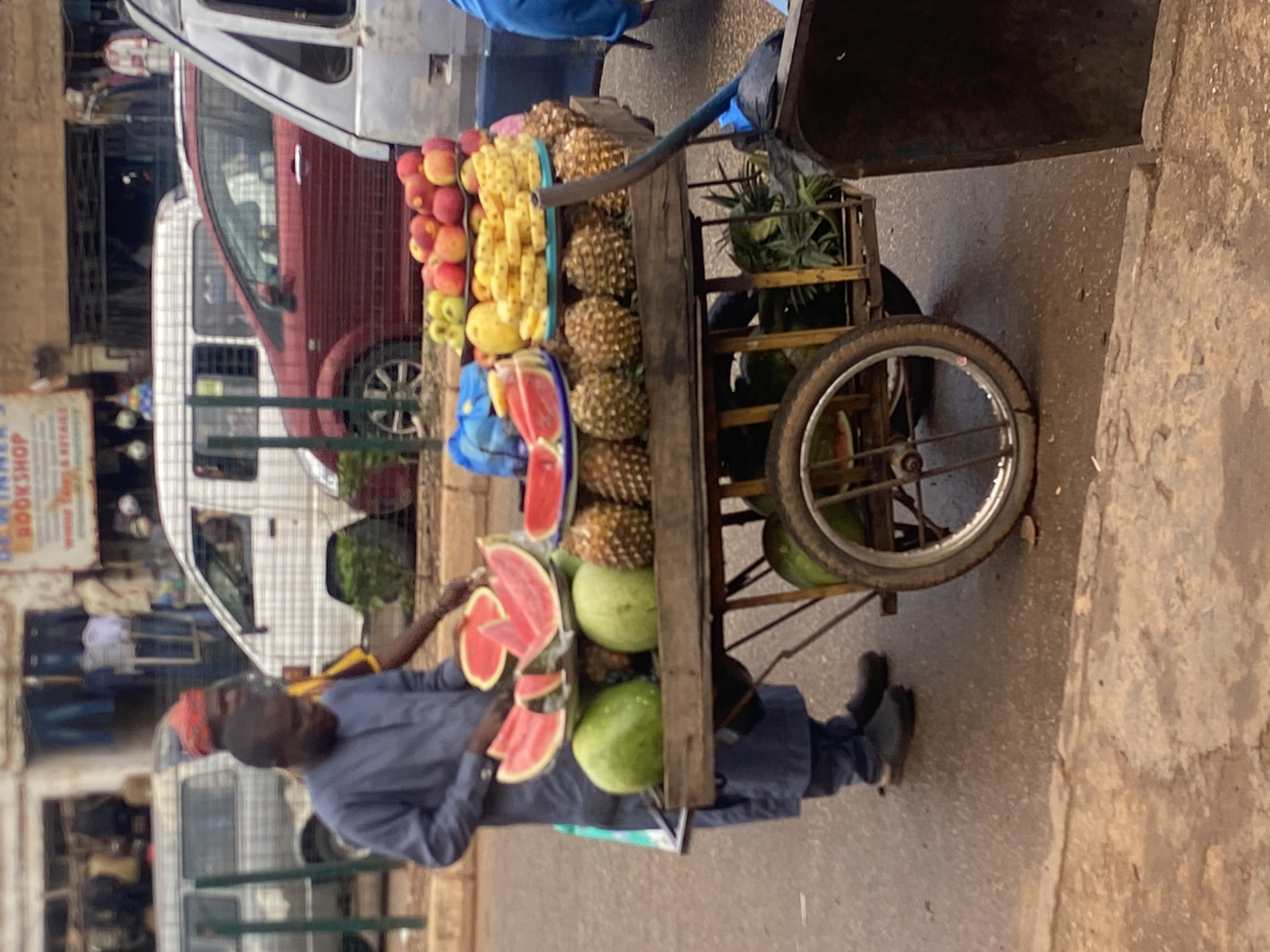 Midday street and market activity in Bukuru, Nigeria