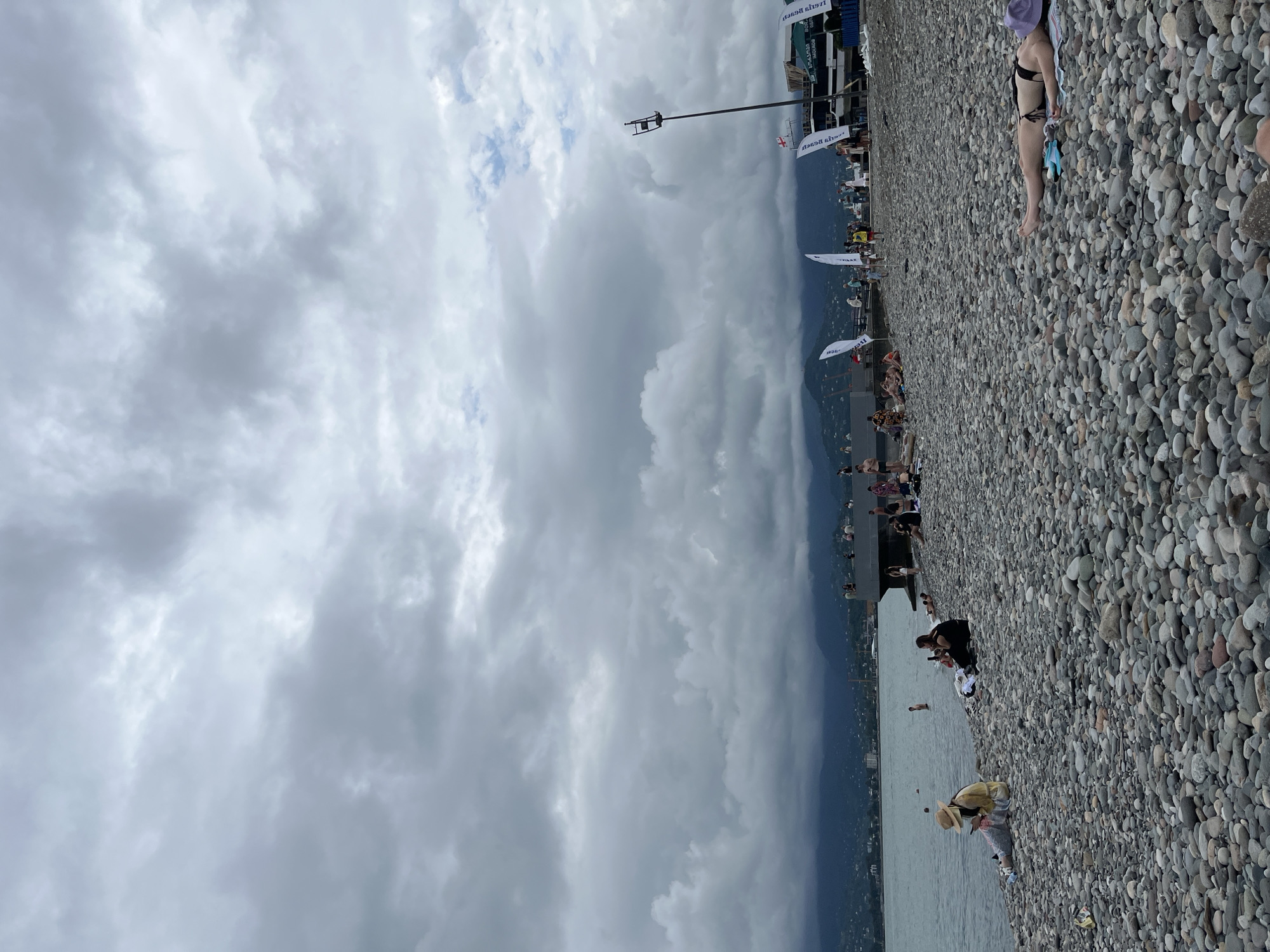 Overcast beach day on Batumi's Black Sea pebble shore