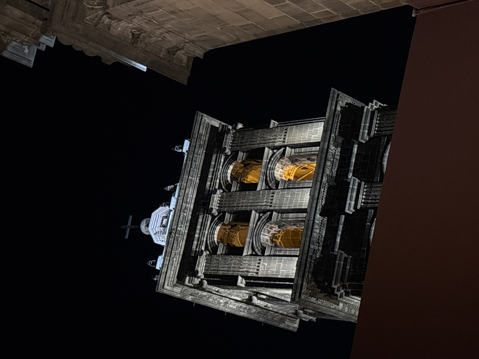 Nighttime documentation of Puebla Cathedral's architecture and gatherings