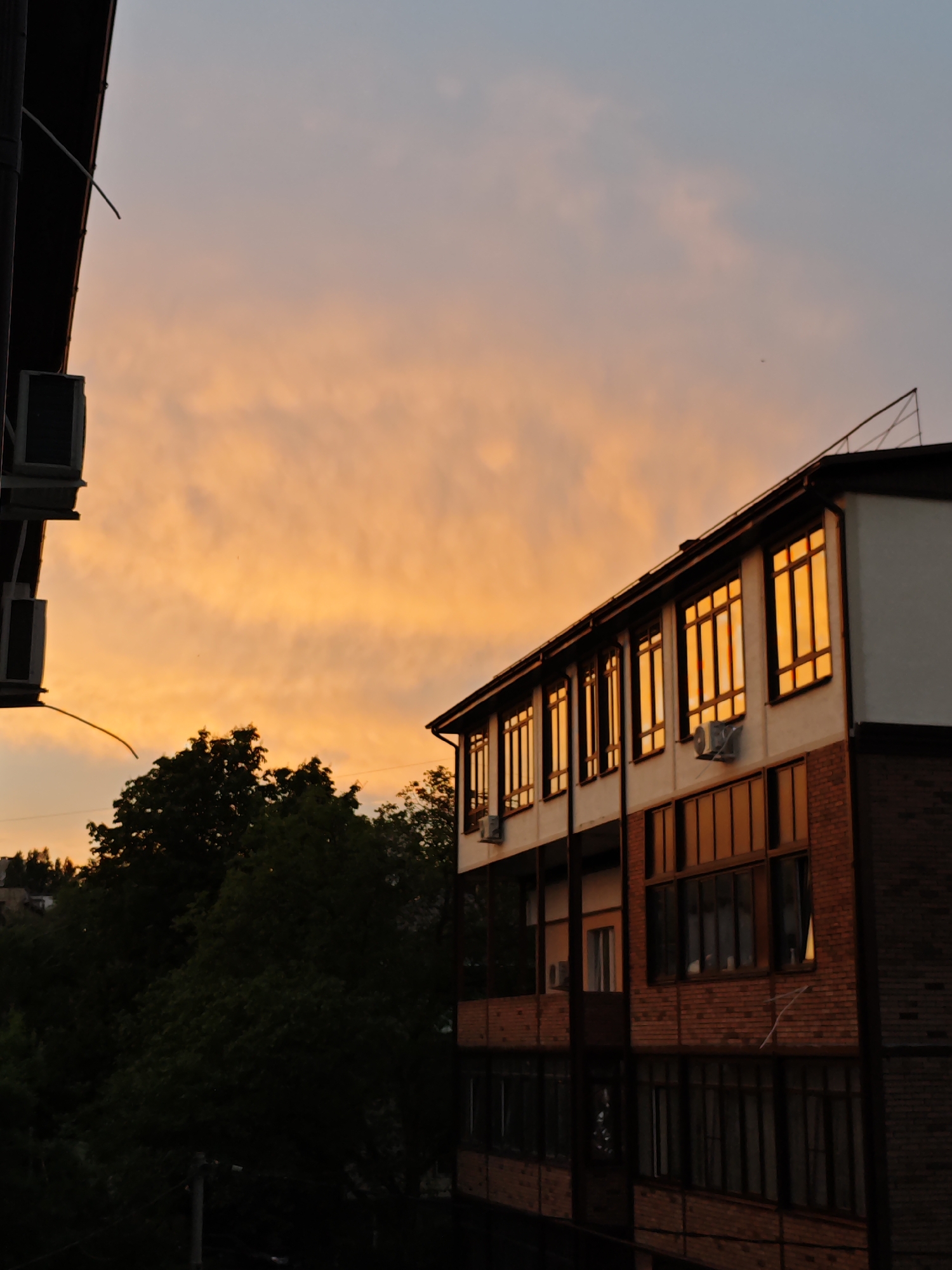 Sunset illuminates residential building and decorative lantern in Pyatigorsk