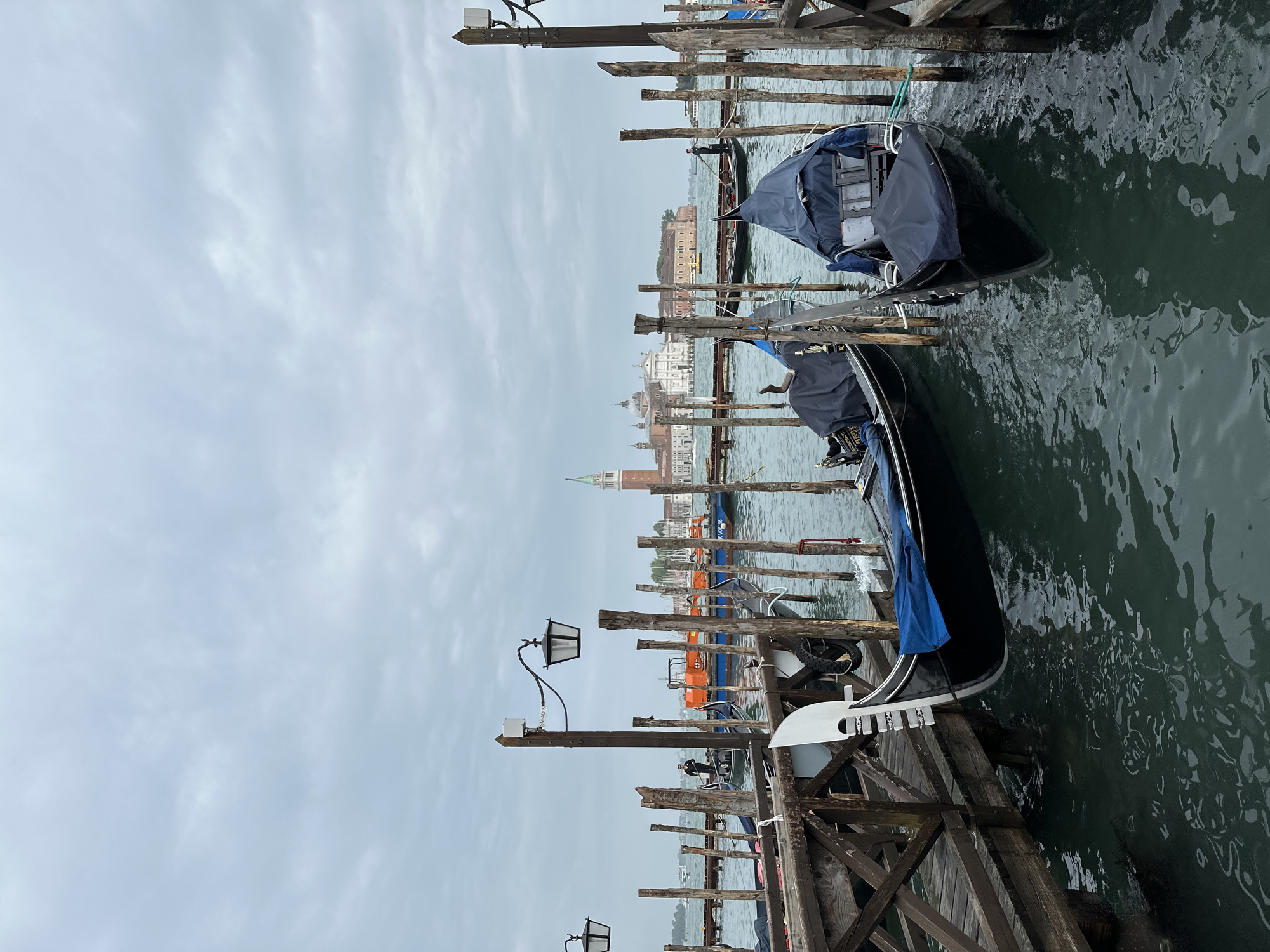 Gondolas moored along Venice canal documented by witness