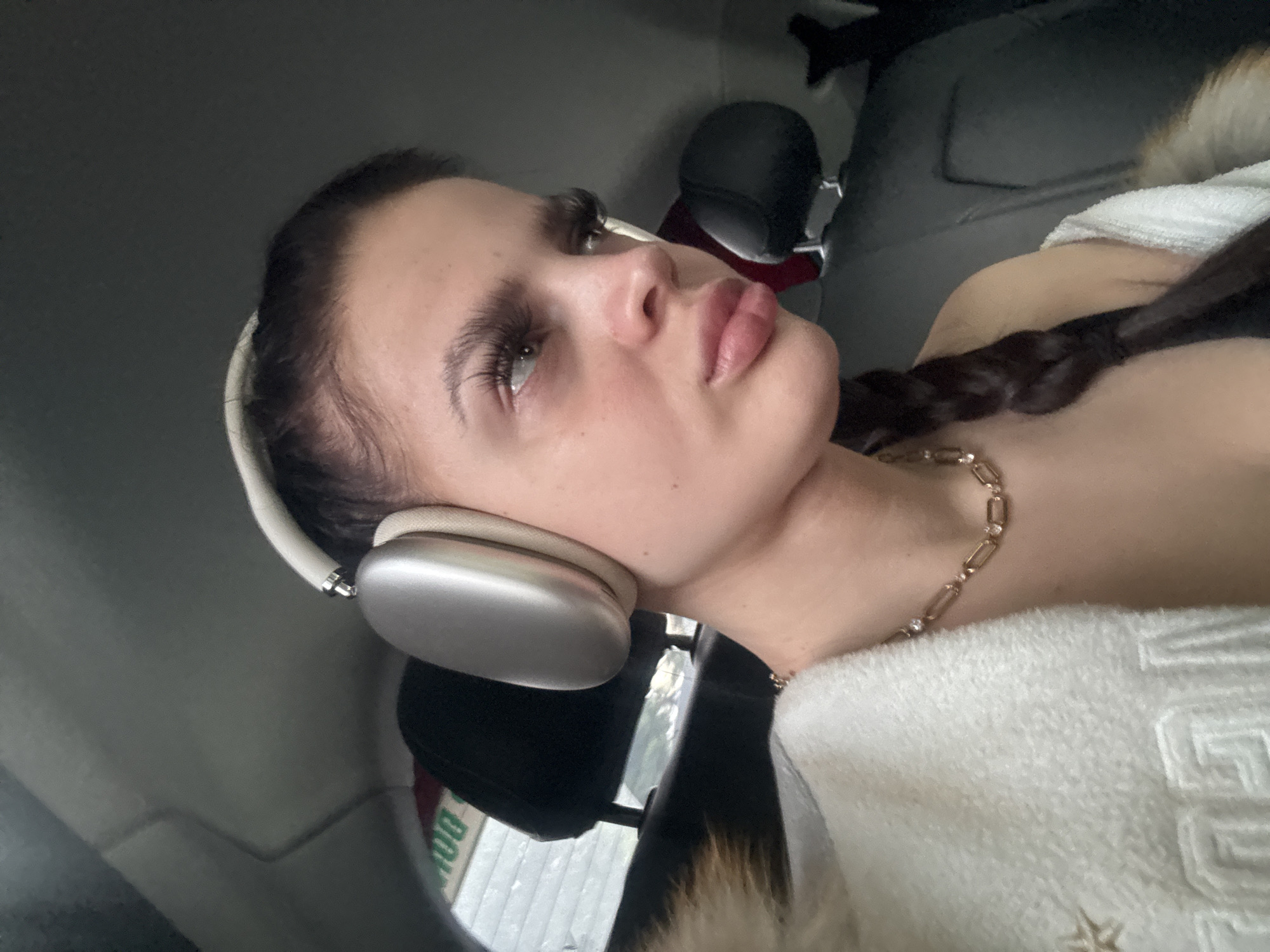 Two close interior car shots, headphones on, Hà Nội
