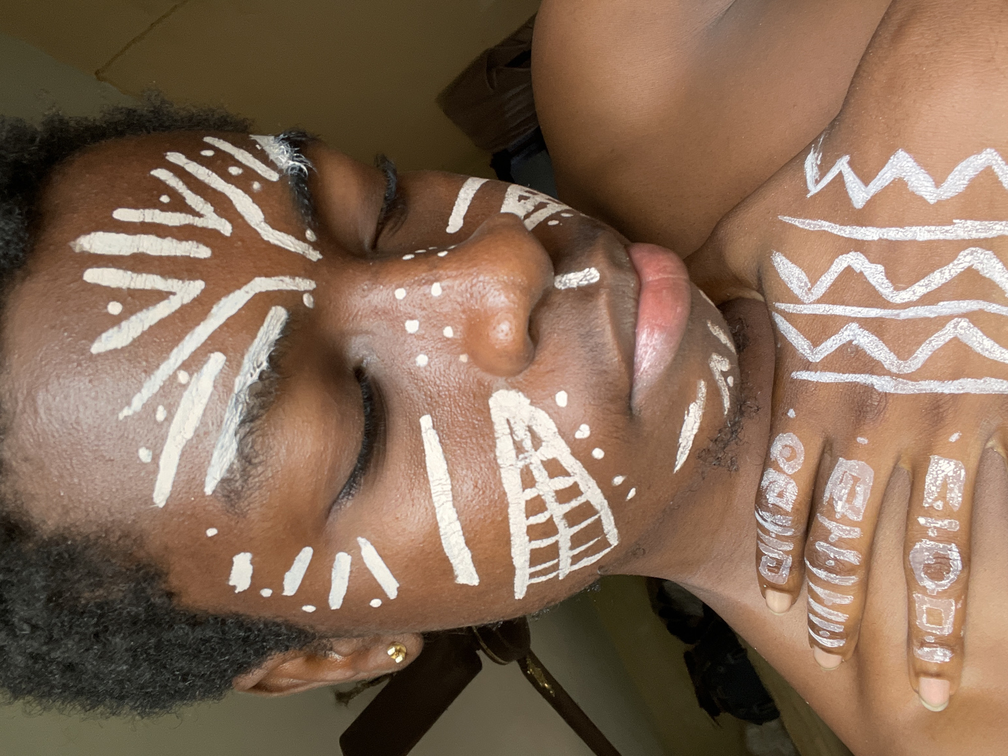 Traditional white body paint portraits documented in Nkpor, Nigeria