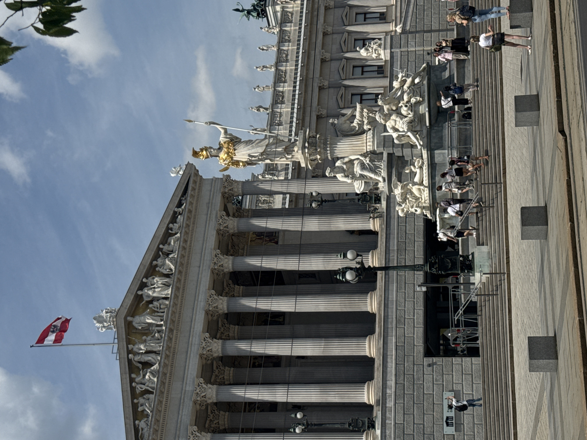Classical architecture with marble columns documented under clear skies