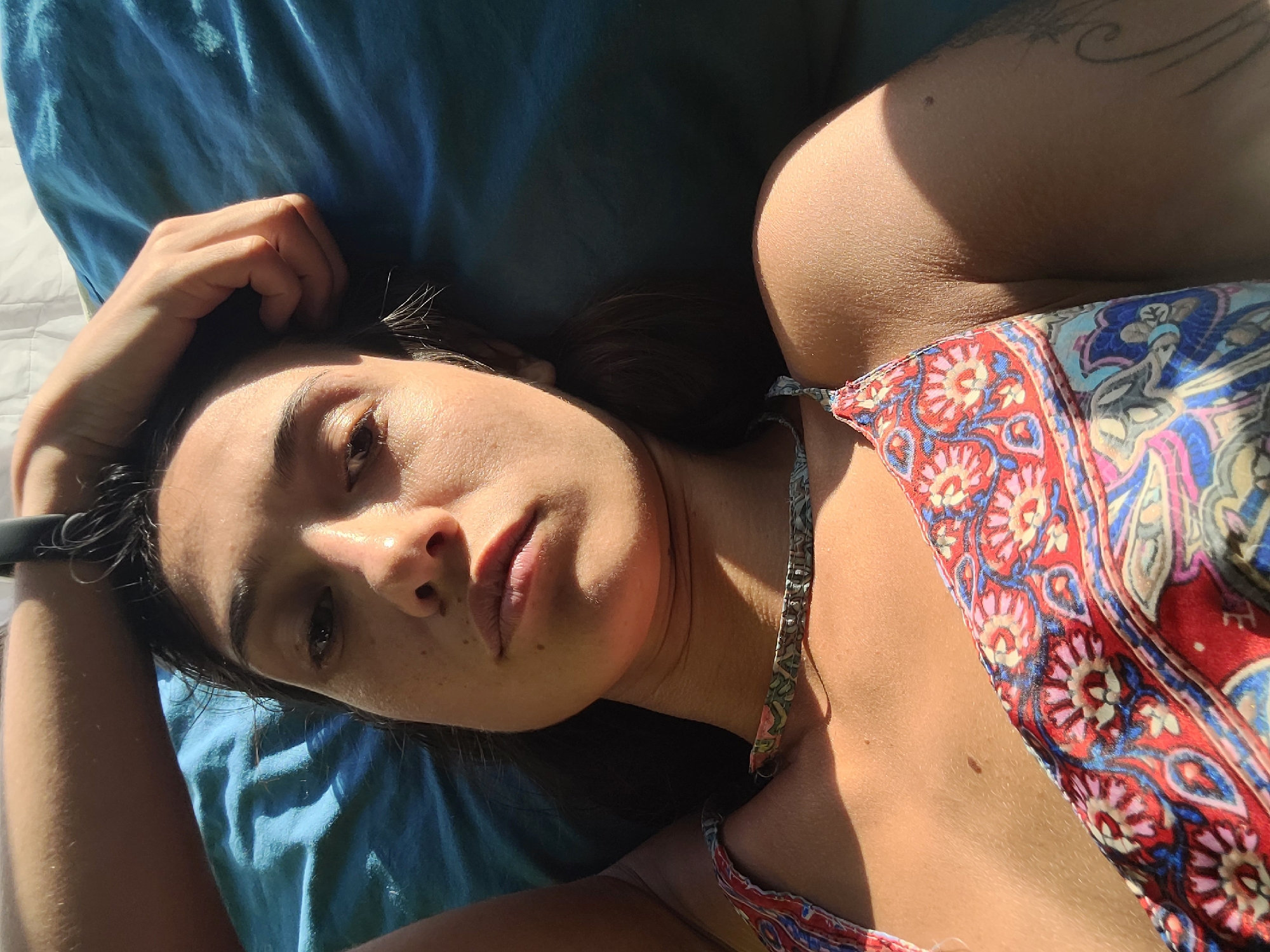 Woman rests indoors under bright LED lighting