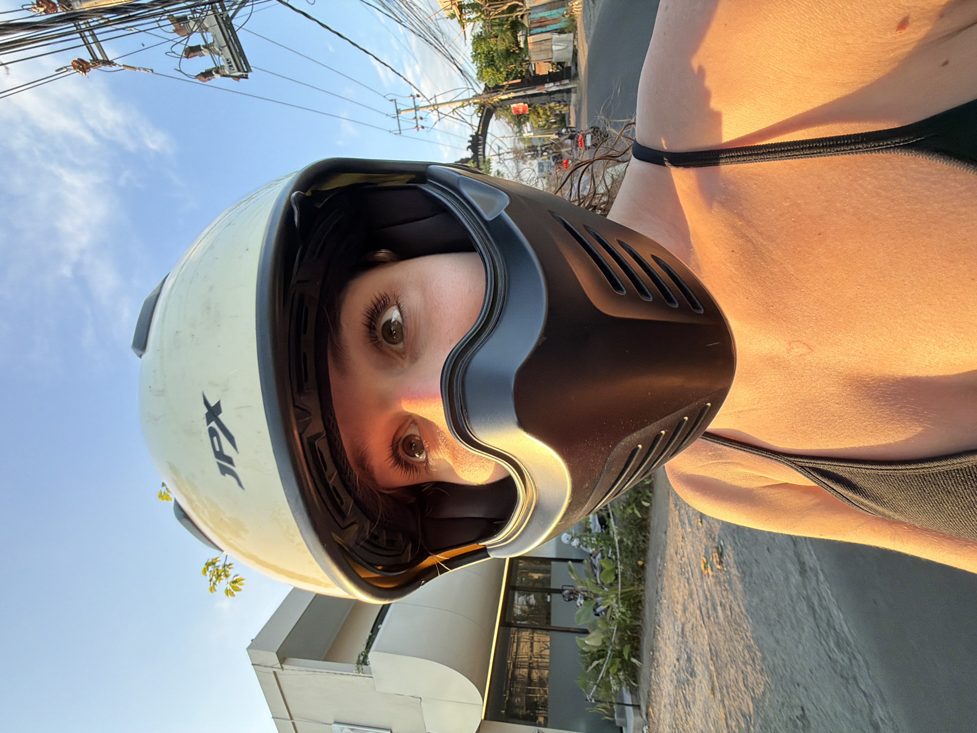 Woman documents scooter ride through North Kuta rice paddies
