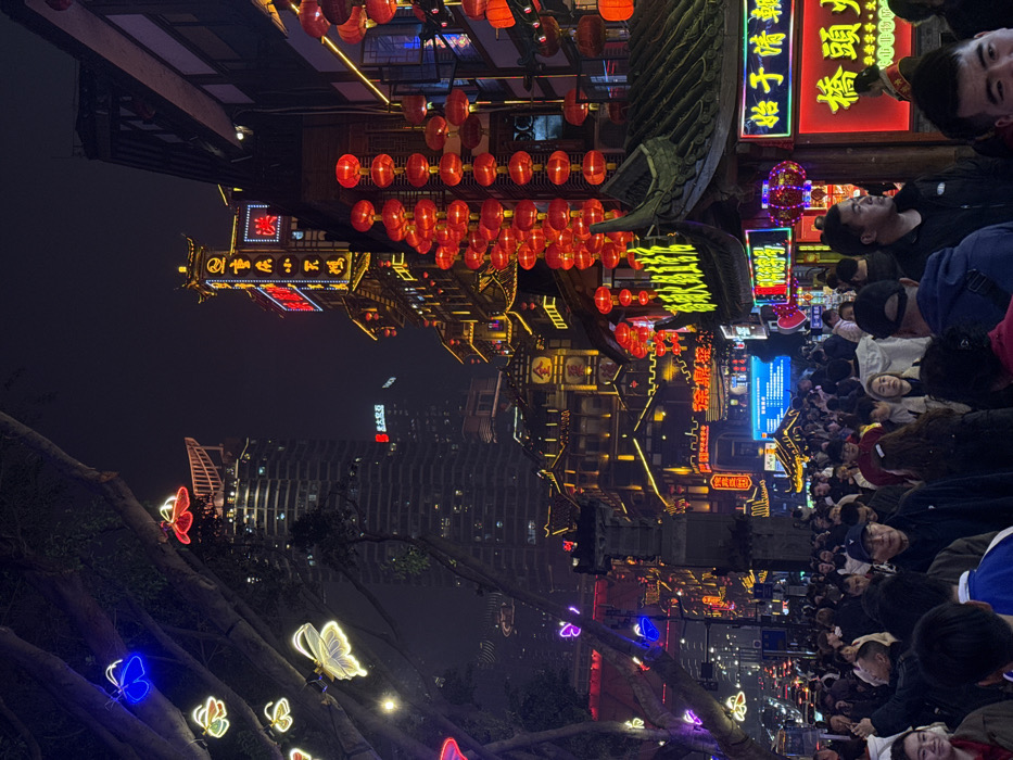 Nighttime crowds gather at Chongqing's illuminated Hongyadong tourist district