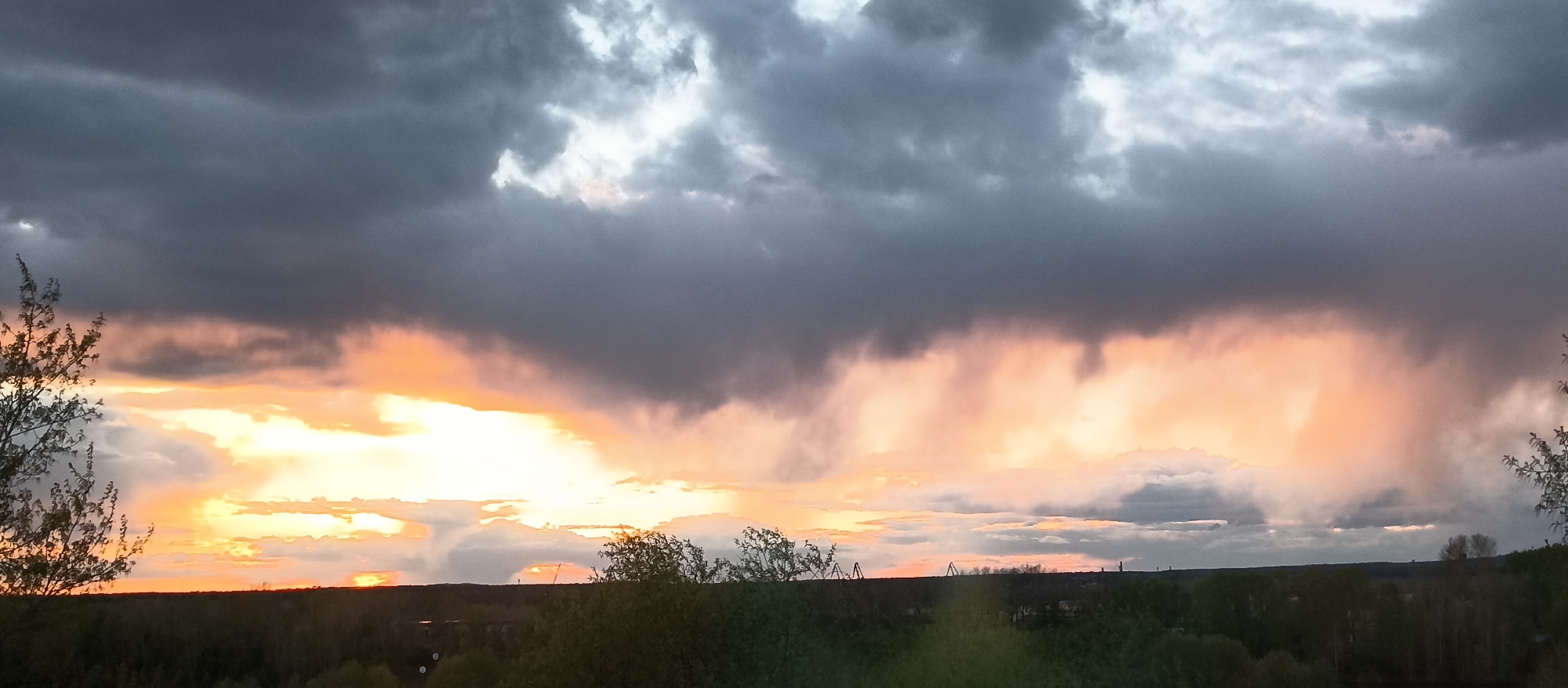 Personal moments captured: stormy skies, indoor cat, selfie