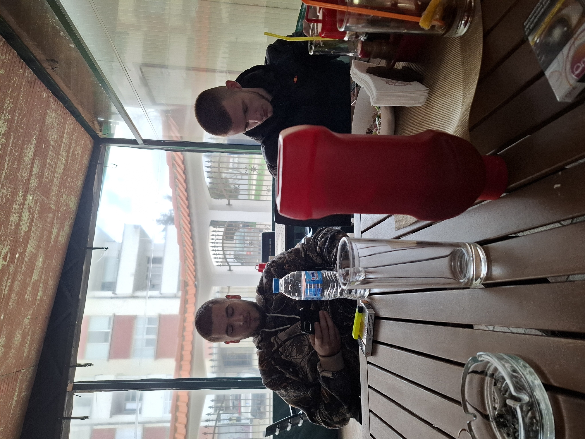 Two men dine at restaurant in Strazhitsa, Bulgaria
