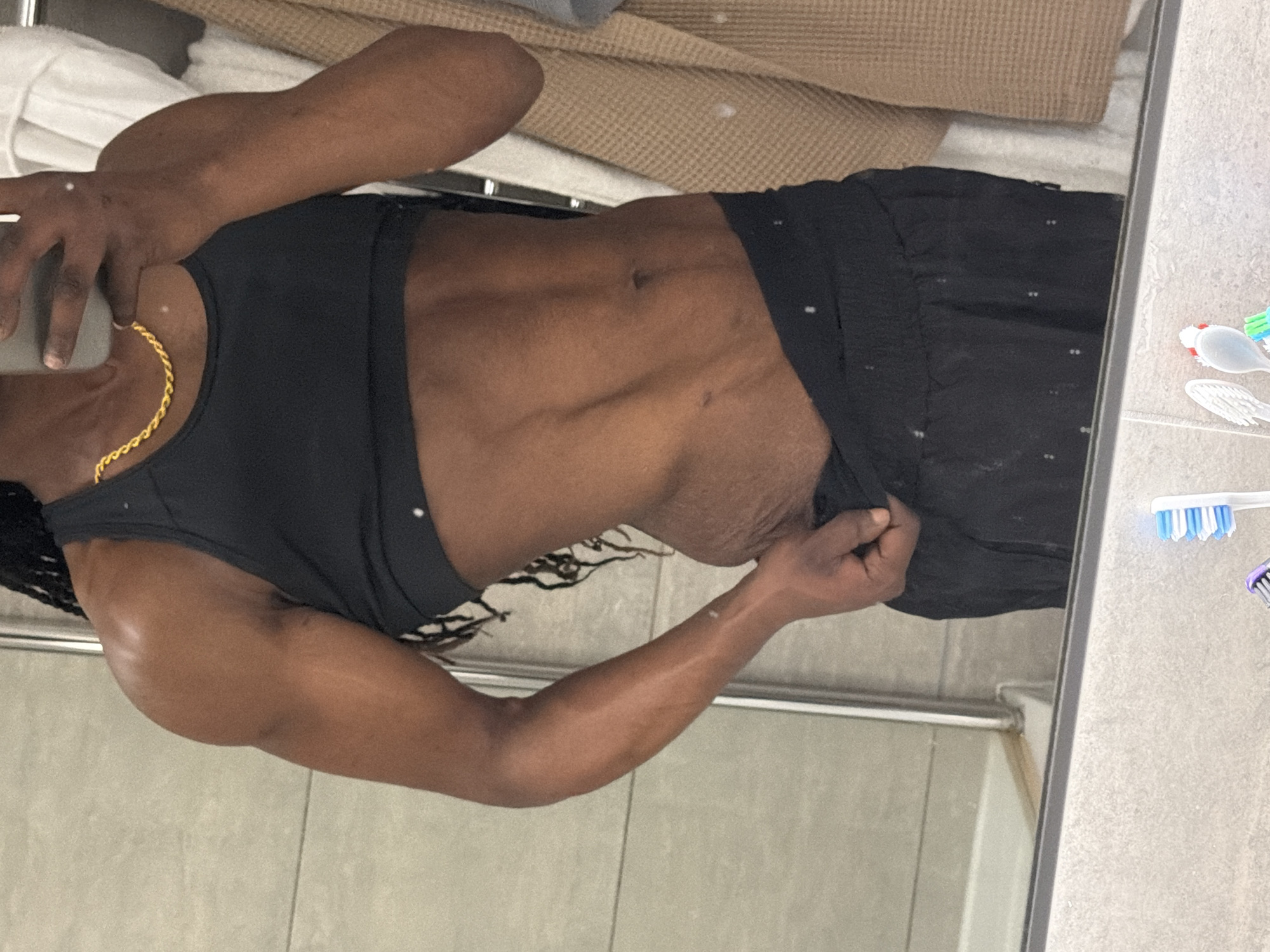 Person takes mirror selfie in London bathroom