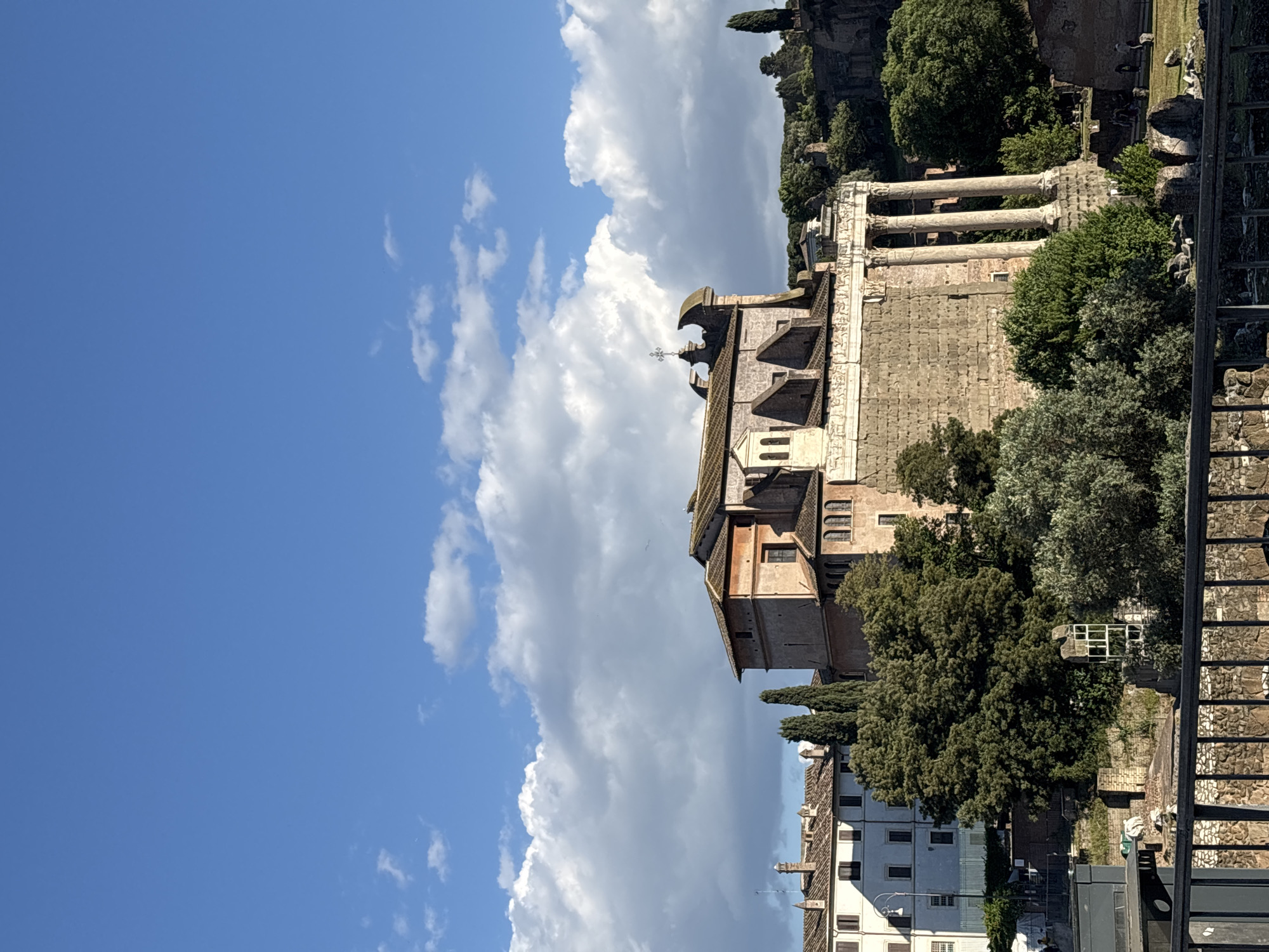 Tourist documents Roman Forum and historic sites during afternoon visit