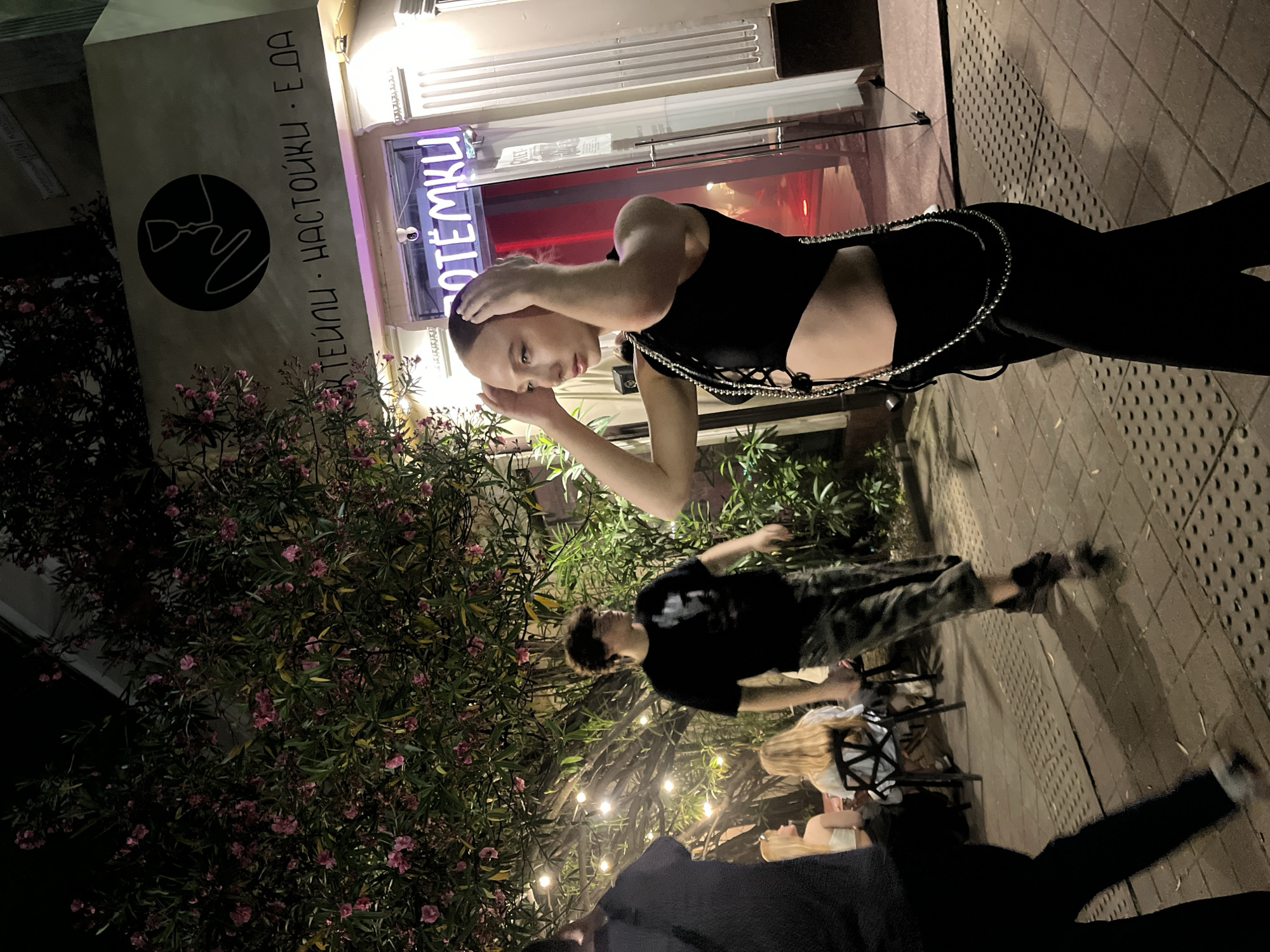 Night out at a Sochi bar, neon-lit street scene