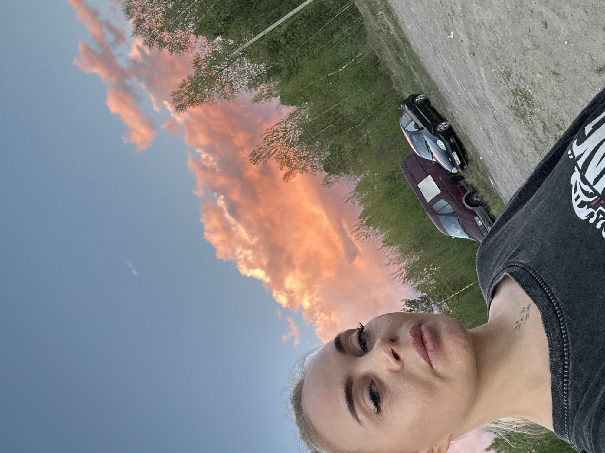 Woman photographs sunset with dog in Russian town