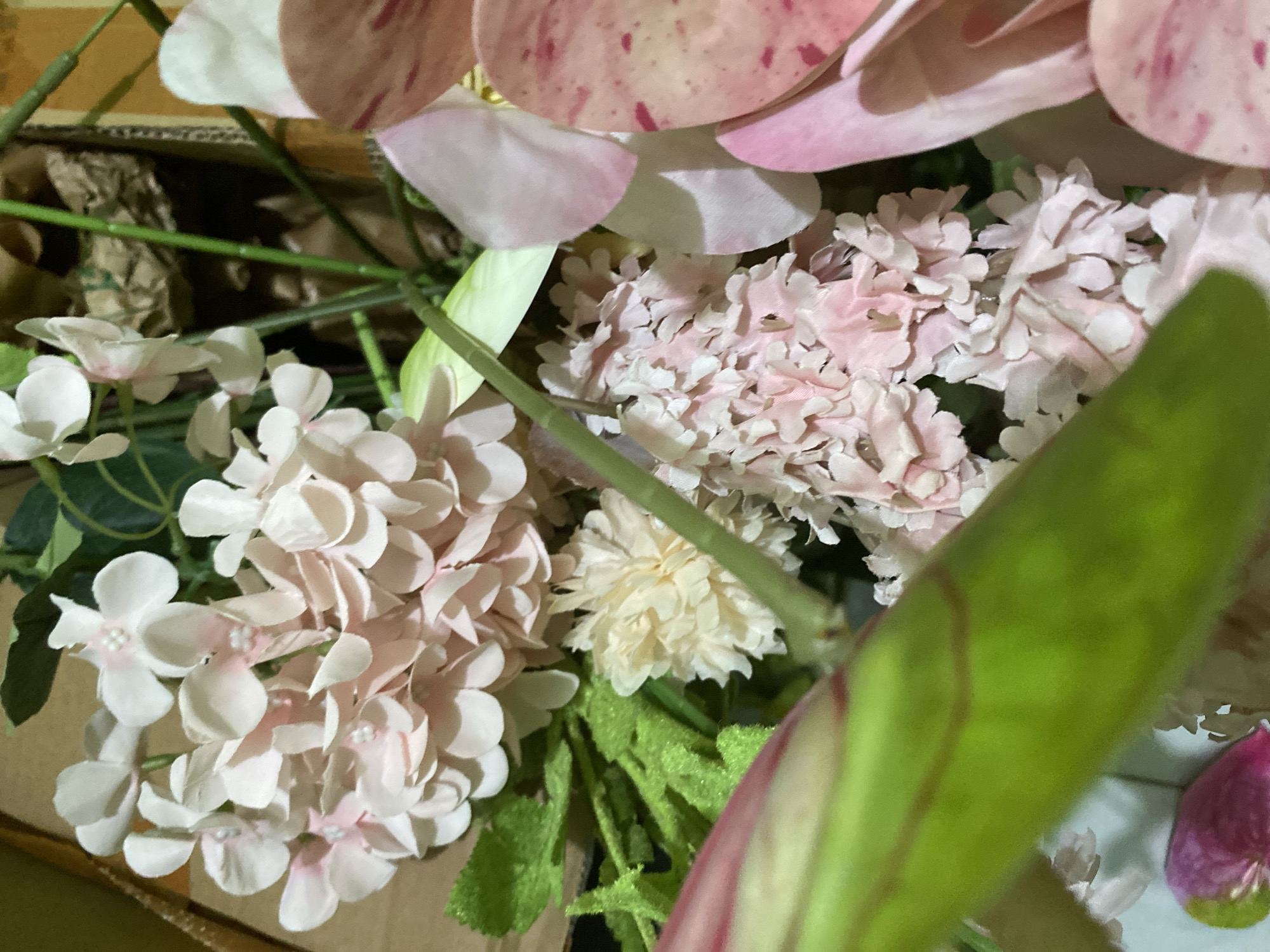 Pink and white floral arrangements, real and artificial, in Kuala Pembuang