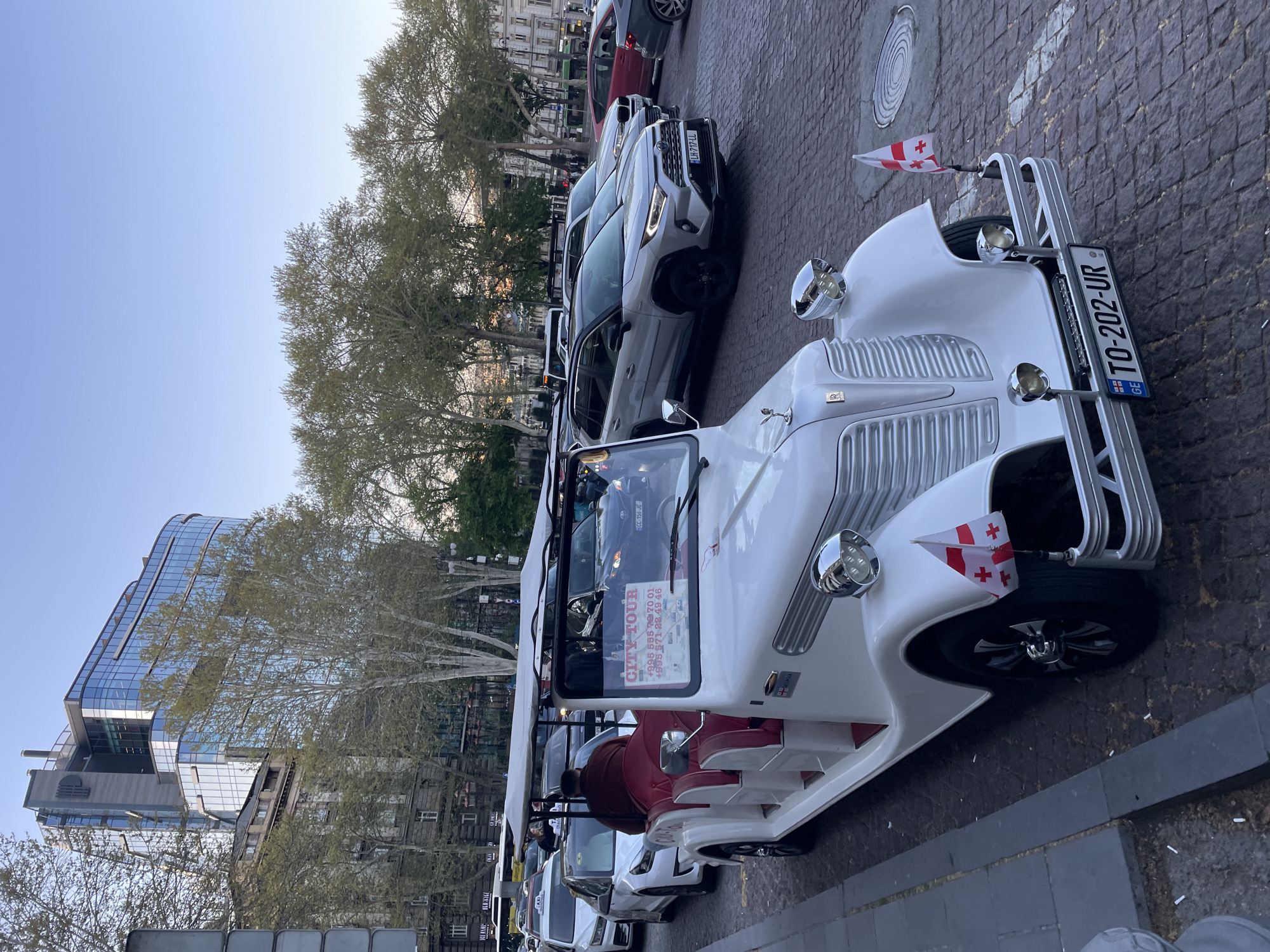 Tourist documents afternoon walk through historic Tbilisi streets