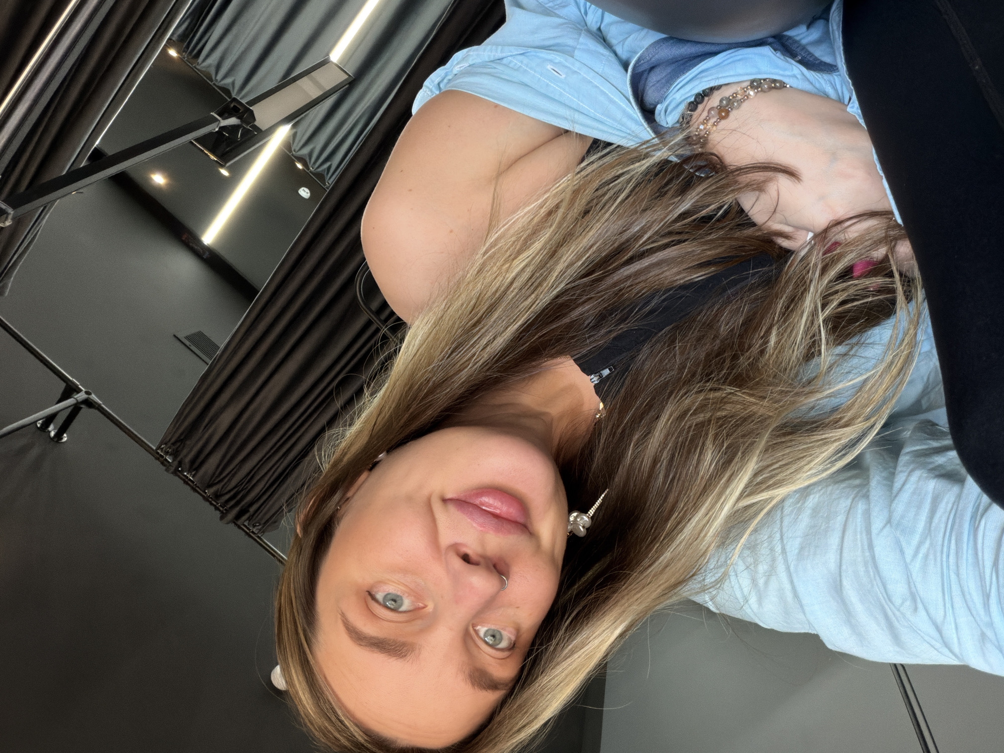 Woman spotted in Moscow dressing room wearing blue shirt