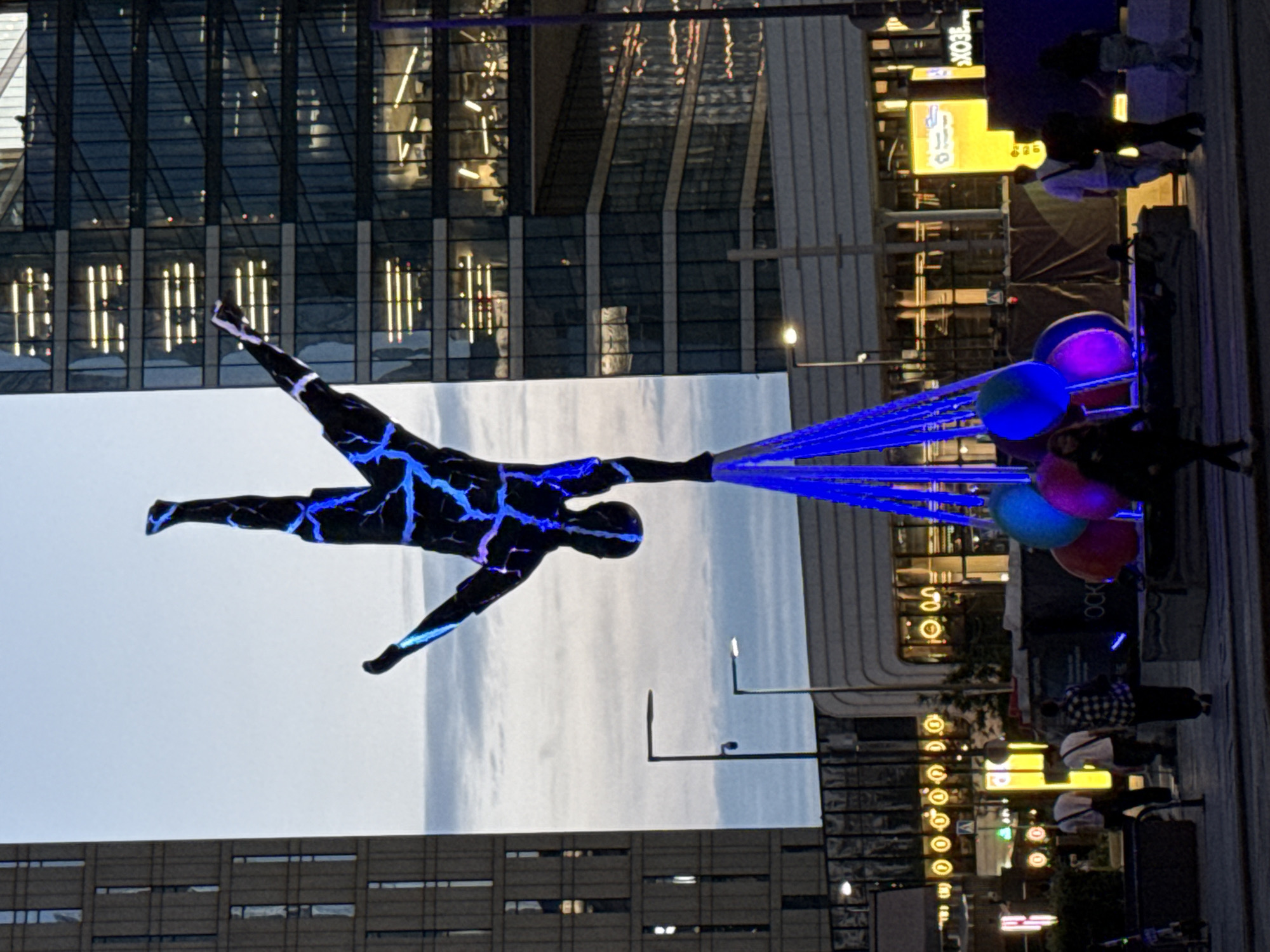 Bold black sculpture with orange detail outside Moscow skyscraper