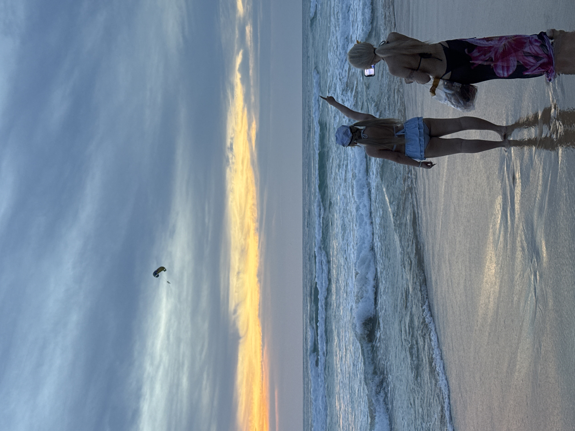 Karon Beach at sunset, people scattered along the shoreline