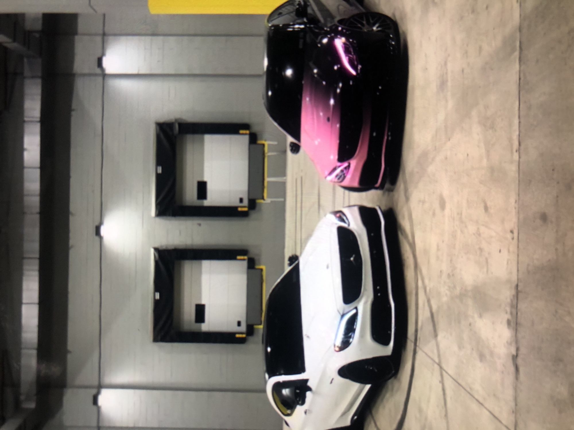 Two cars parked in indoor facility, Lhokseumawe Indonesia