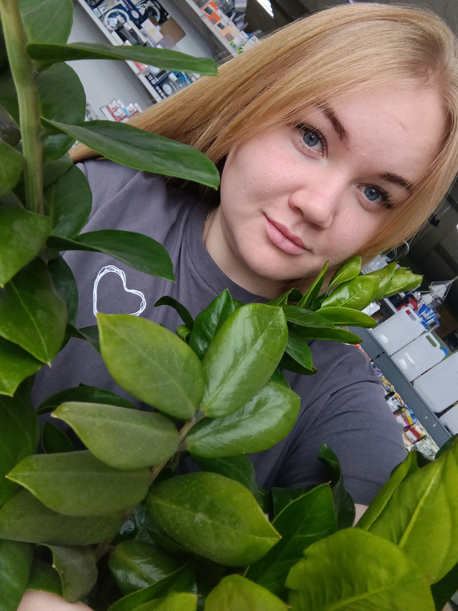 Woman takes selfies with plant in Russian town