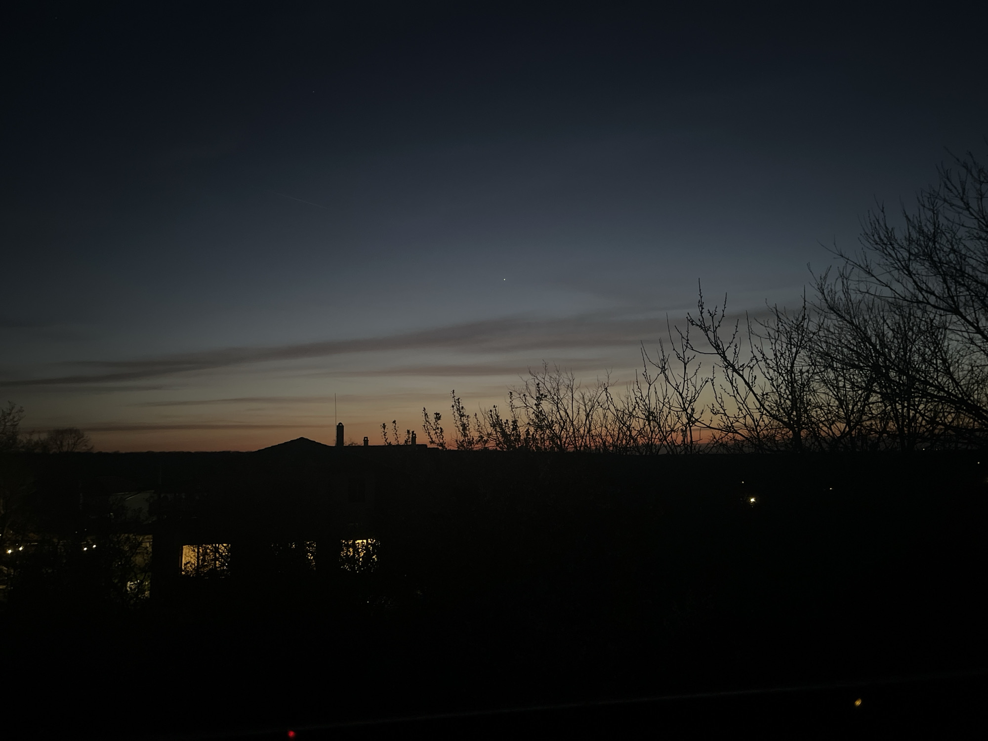 Twilight documented in Oreshak, Bulgaria with illuminated buildings