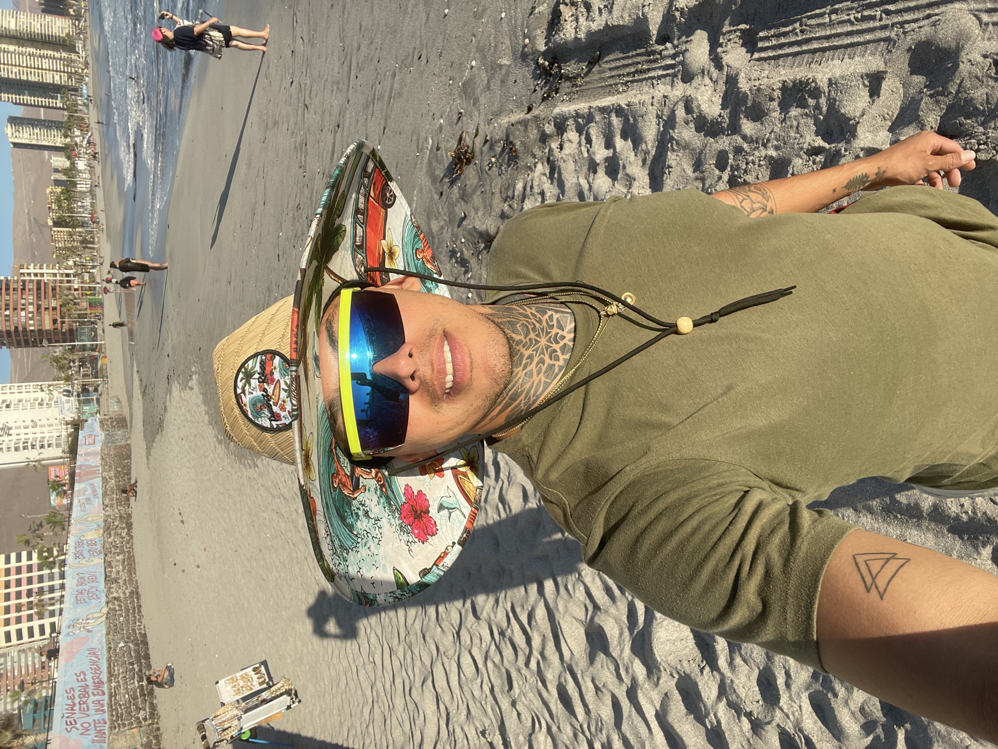 Man rests on Iquique beach in evening hours