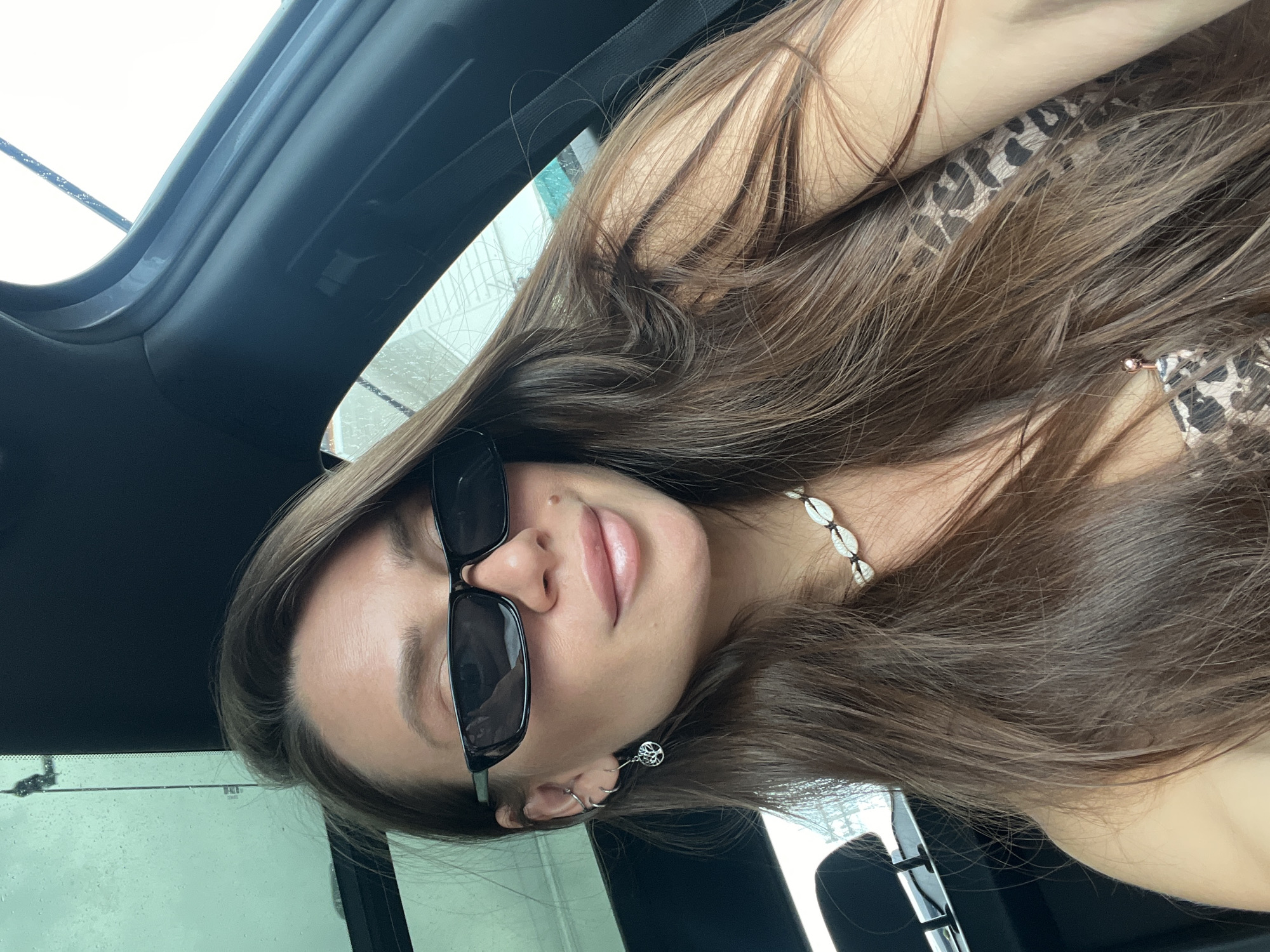 Woman takes car selfies in early morning session