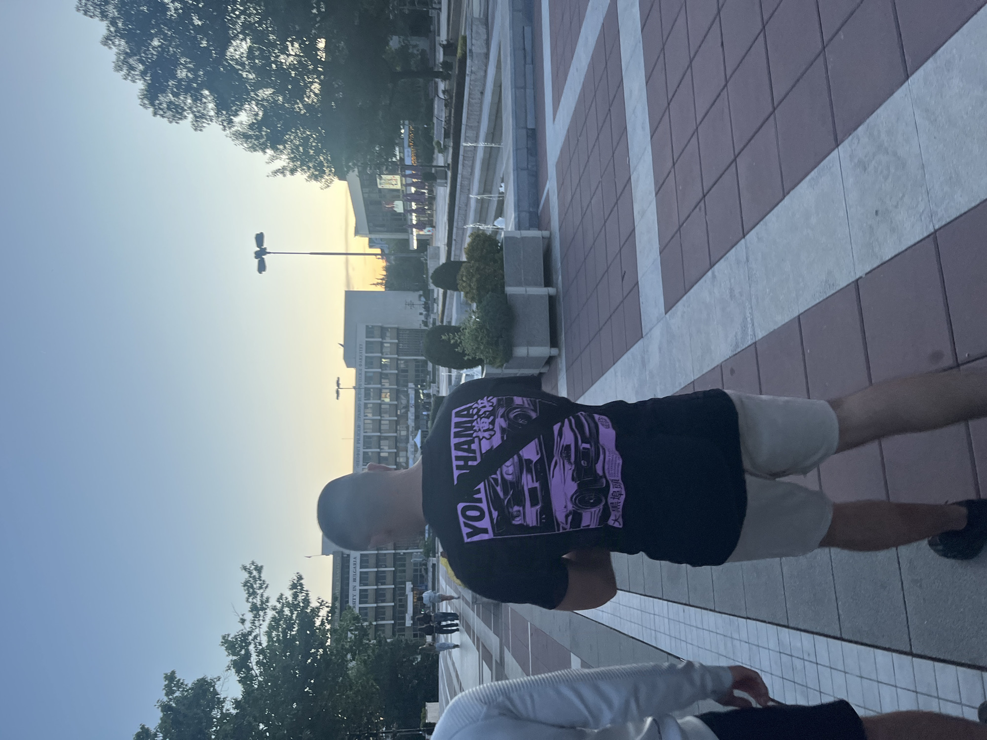 Two men visit fountain area in Blagoevgrad during afternoon walk