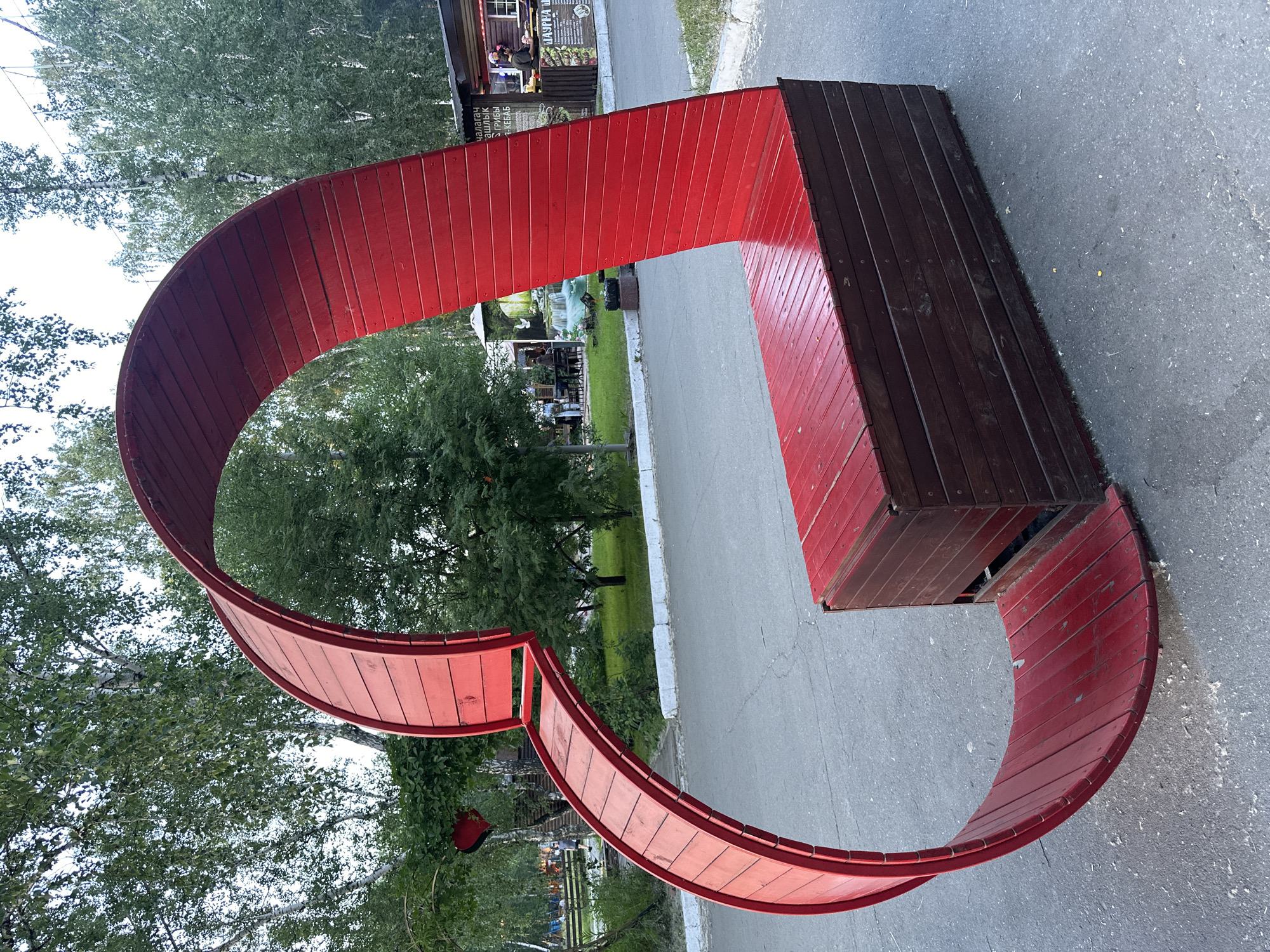 Afternoon park activities captured at illuminated fountain plaza in Omsk