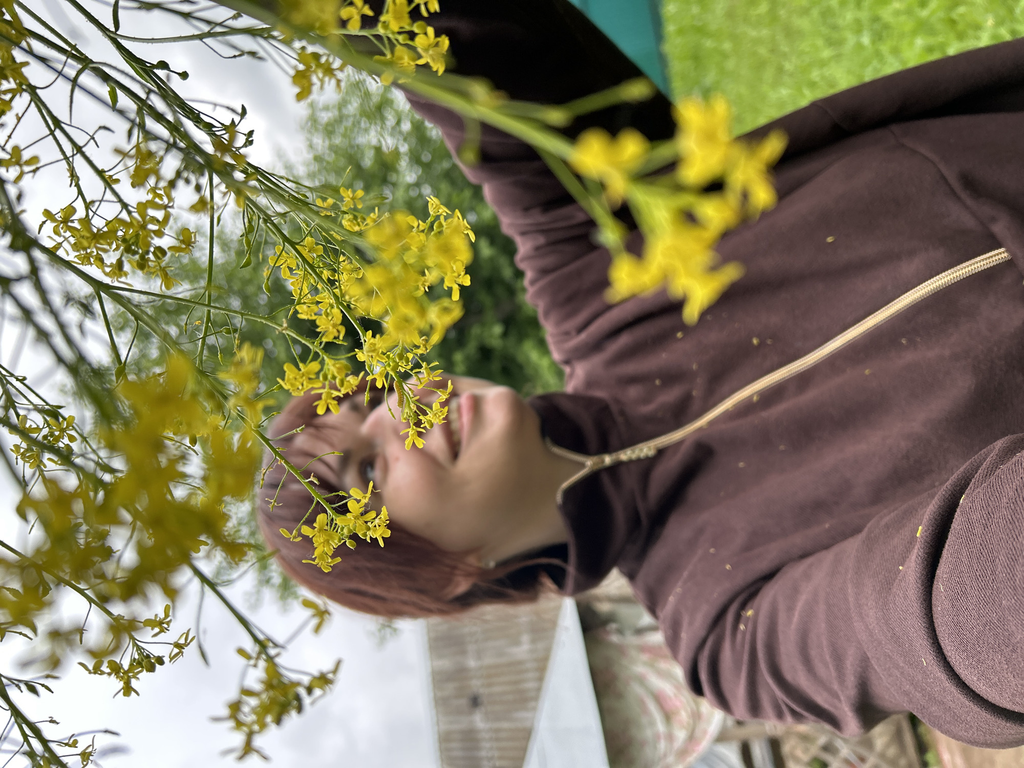 Woman poses for outdoor flower portraits in Фоки Russia