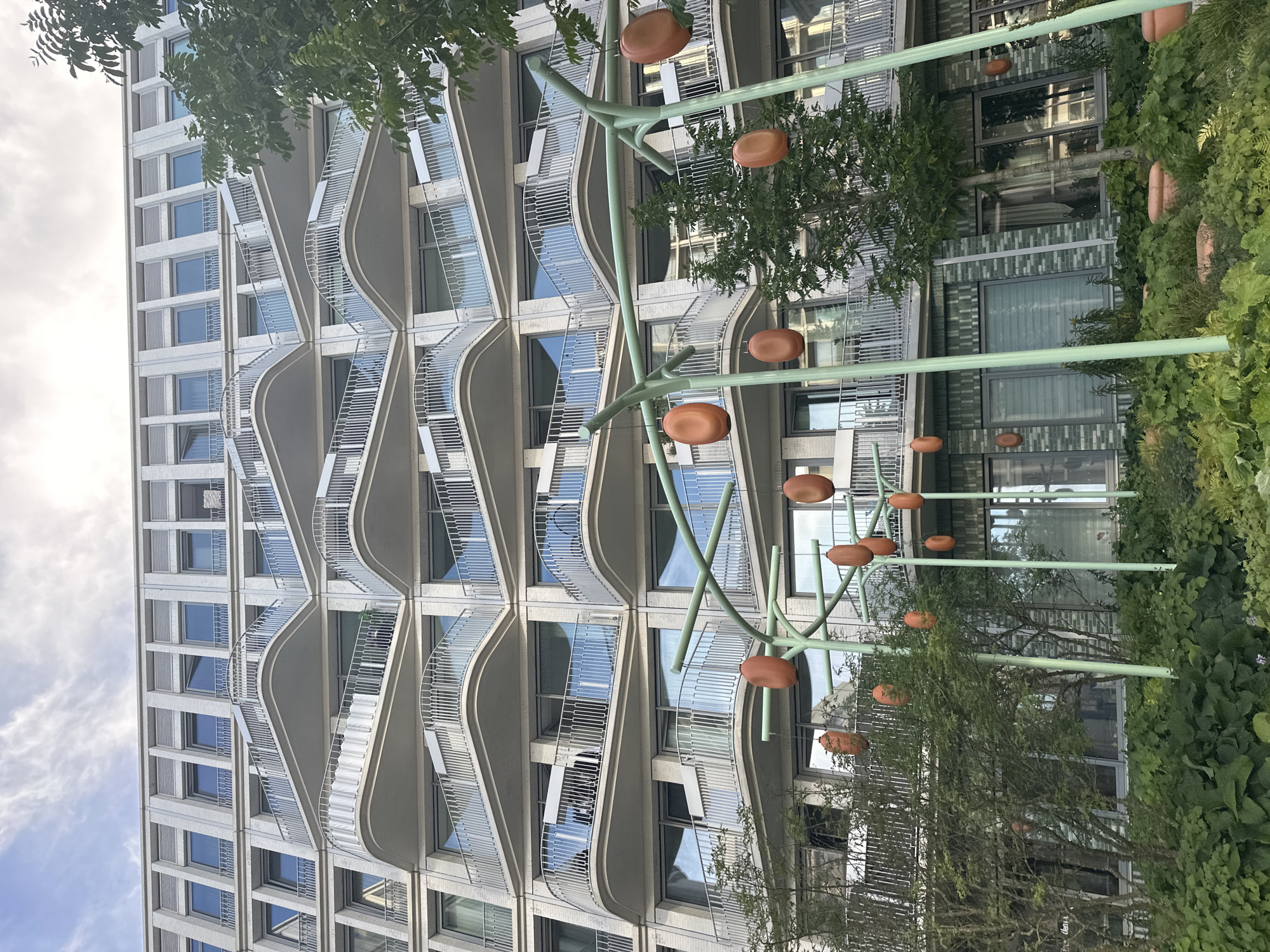 Amsterdam's wave-balcony apartment complex on a sunny afternoon